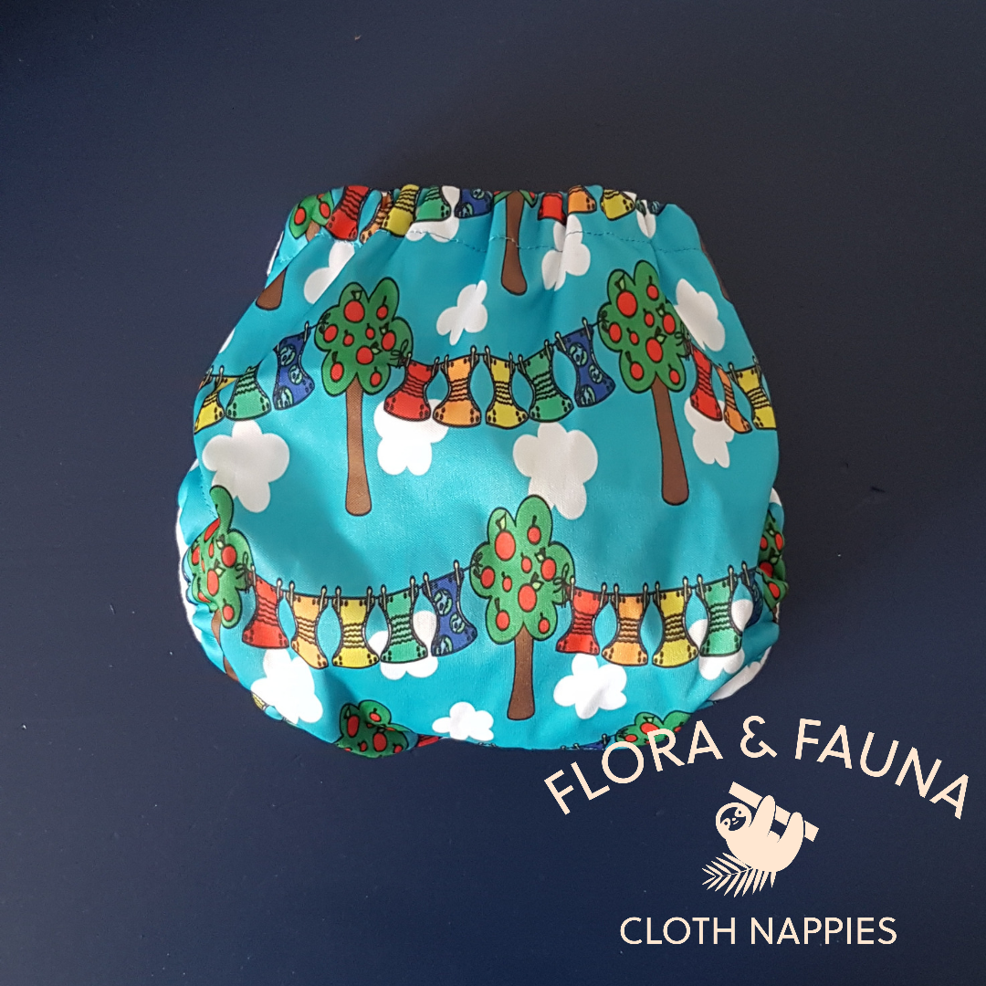 Back view of a nappy in reusable rainbow print