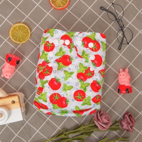 White background tomatoes and basil print pocket nappy in  a basket with toy props