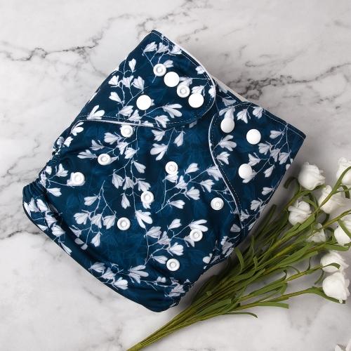 Dark blue pocket nappy with a small white magnolia shaped flowers in a white basket