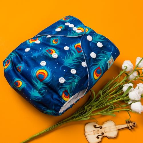 Dark Blue background pocket nappy with peacock feathers on an orange background