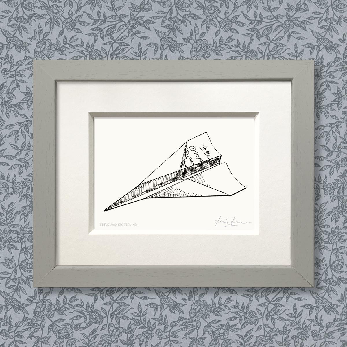 Limited edition print from a pen and ink drawing of a to-do list folded into a paper aeroplane in a grey frame