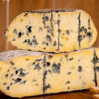 Artisan cheese selection featuring a variety of gourmet cheeses, including brie, blue cheese, and cheddar, perfect for cheese lovers