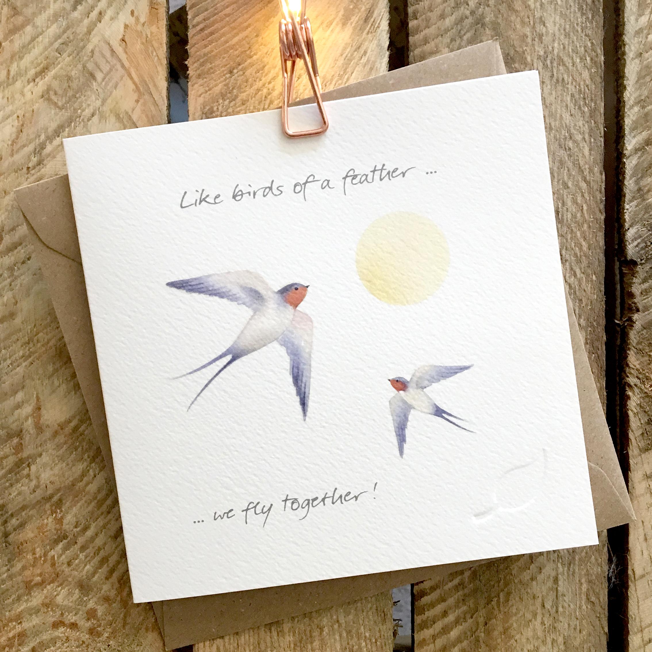 Card featuring two swooping, flying swallows and sunshine