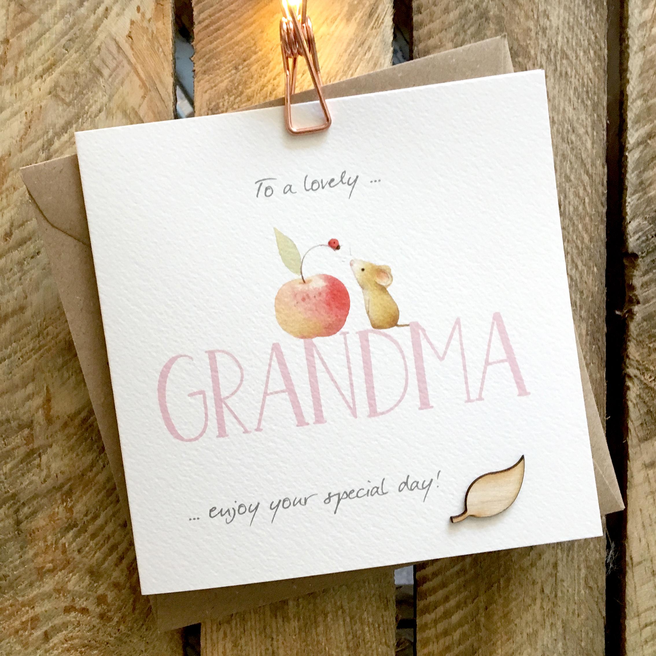 Card featuring a cute little mouse and apple sitting on top of a large GRANDMA caption