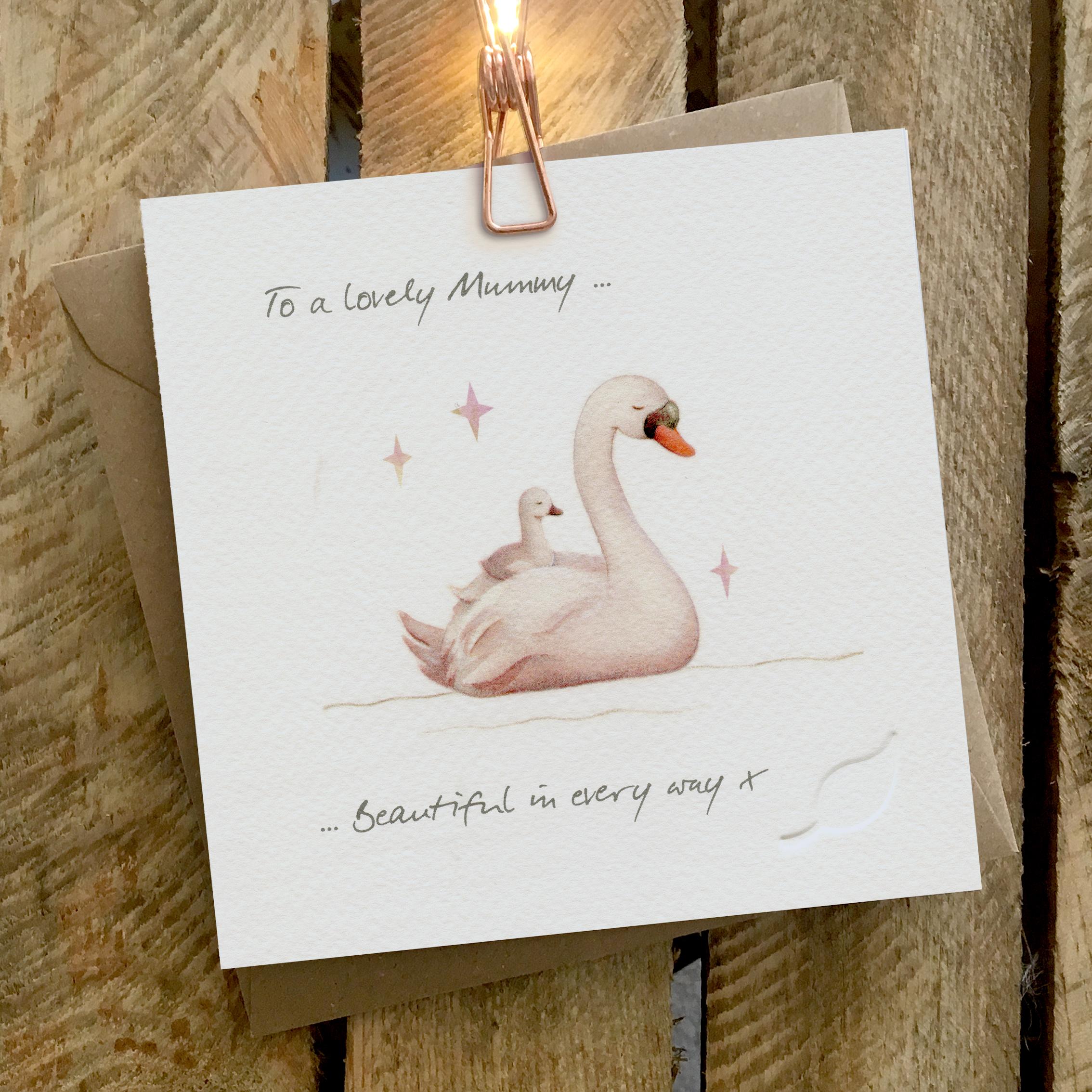 Card featuring a swan carrying a cygnet on it's back