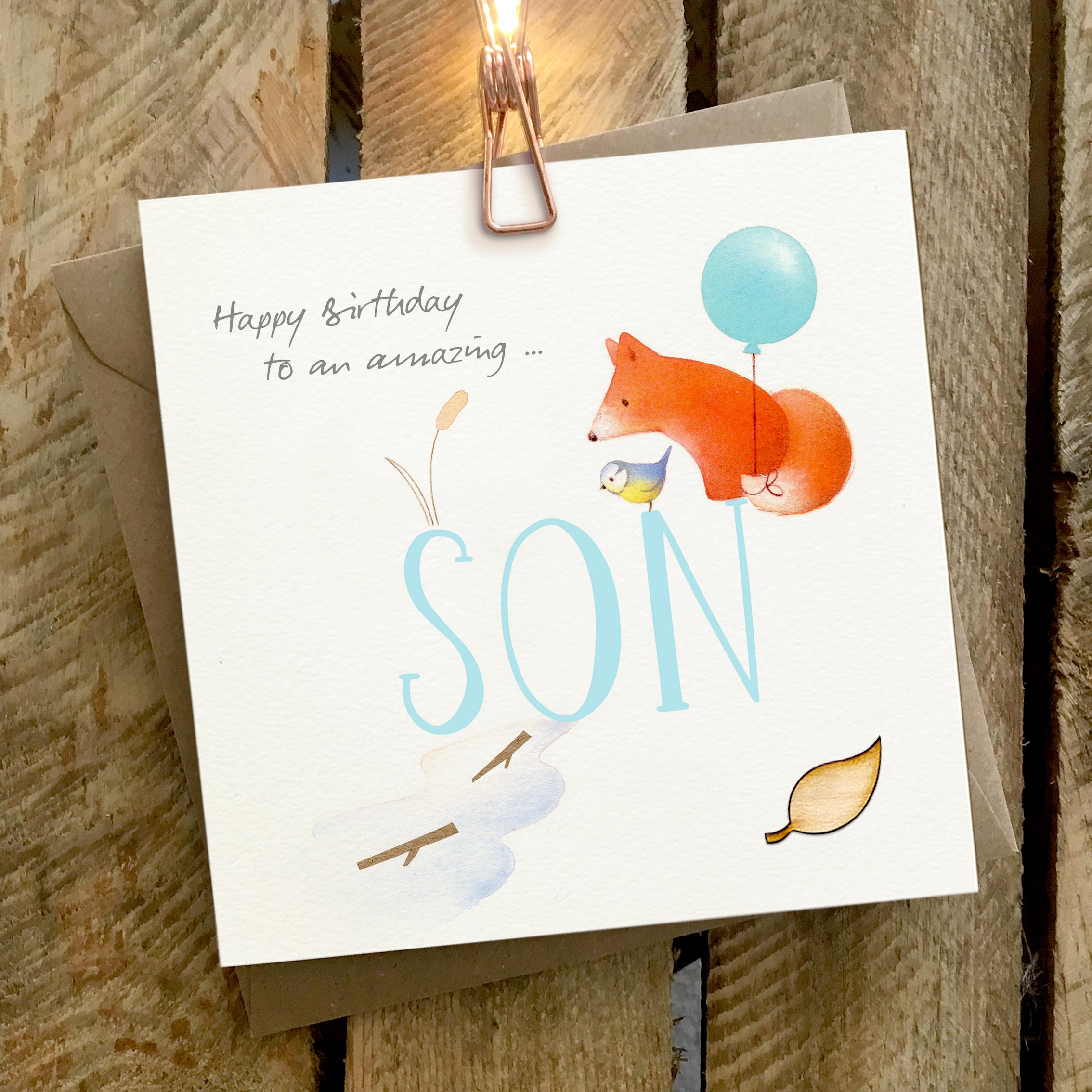 Card featuring a fox with a balloon, and a blue tit, sitting on top of a large SON caption