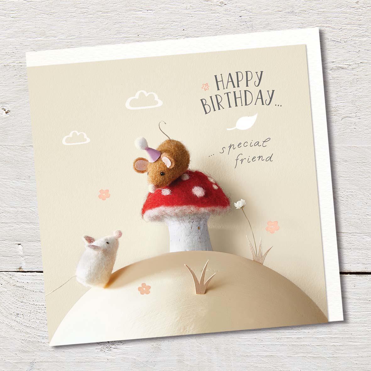 Card featuring two cute felted mice and a spotty red and white mushroom on a tiny hillside.