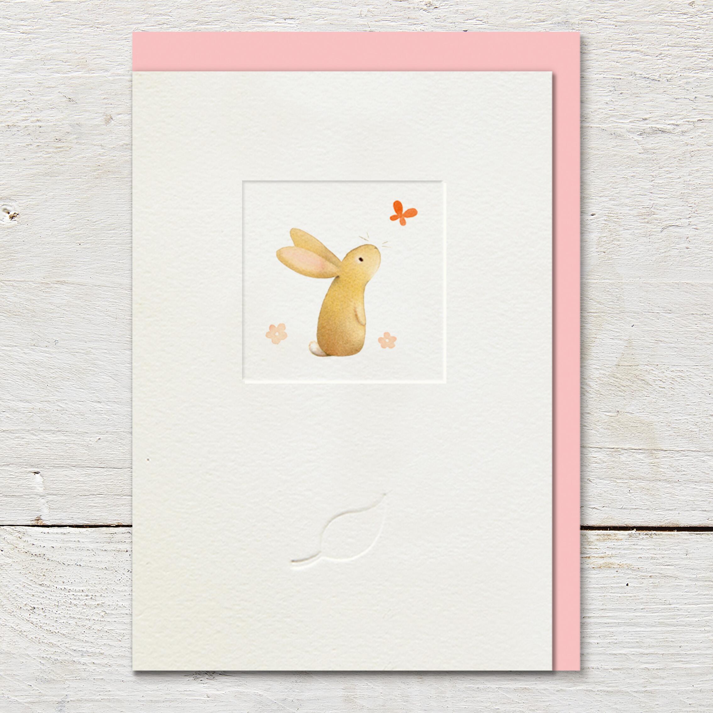 Card featuring an illustration of a cute little rabbit watching a butterfly, in the middle of a small debossed window panel. Card is left blank for an open send.