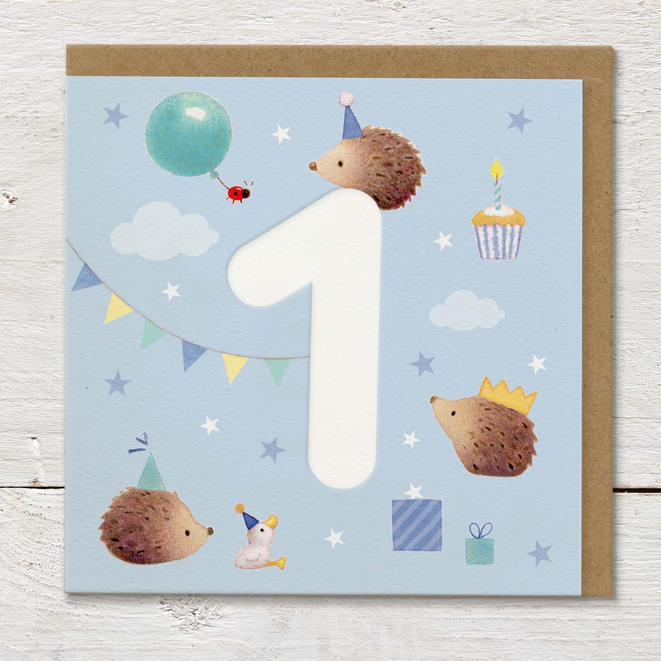Children's age card featuring a large debossed age 1 surrounded by cute hedgehogs and party elements on a pale blue background.