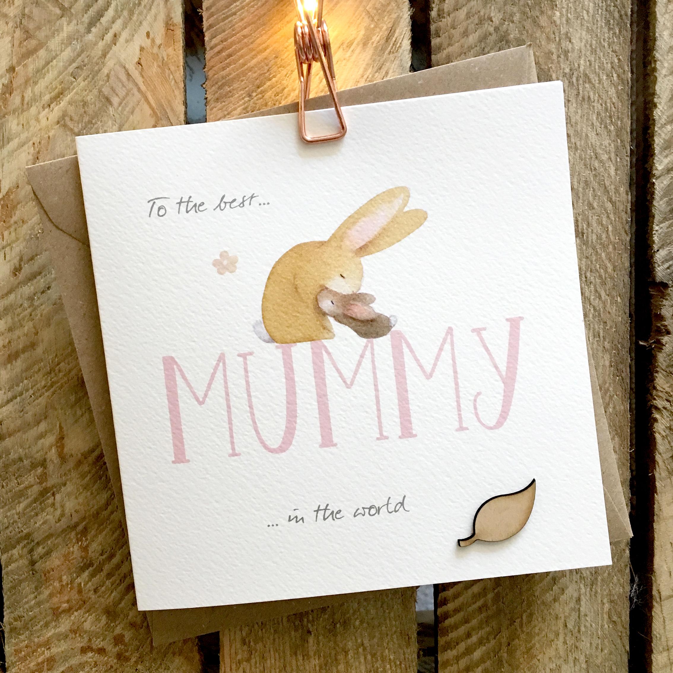 Card featuring cute adult and baby rabbit snuggling on top of large MUMMY caption