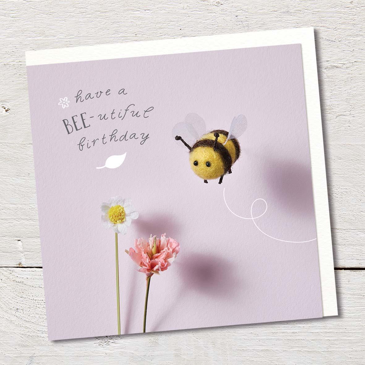 Card featuring a cute felted bumble bee and flowers.