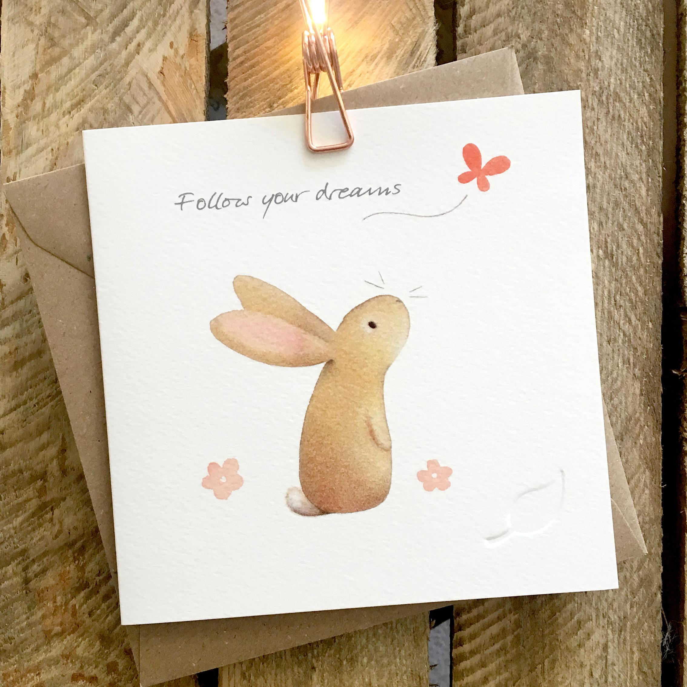 Card featuring cute rabbit watching a butterfly and looking thoughtful