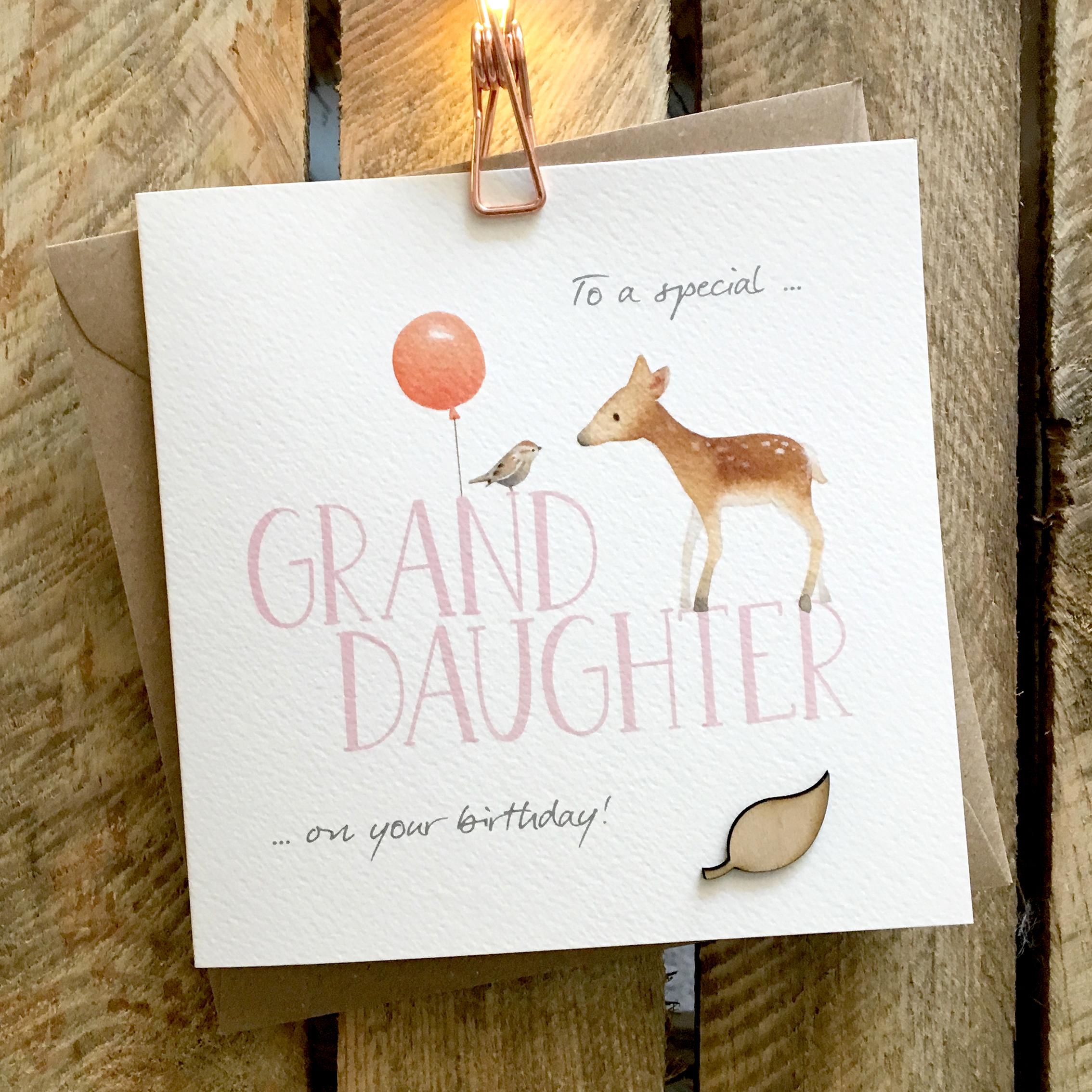 Card featuring a 'Bambi' style fawn and small cute bird standing on top of large GRAND DAUGHTER caption