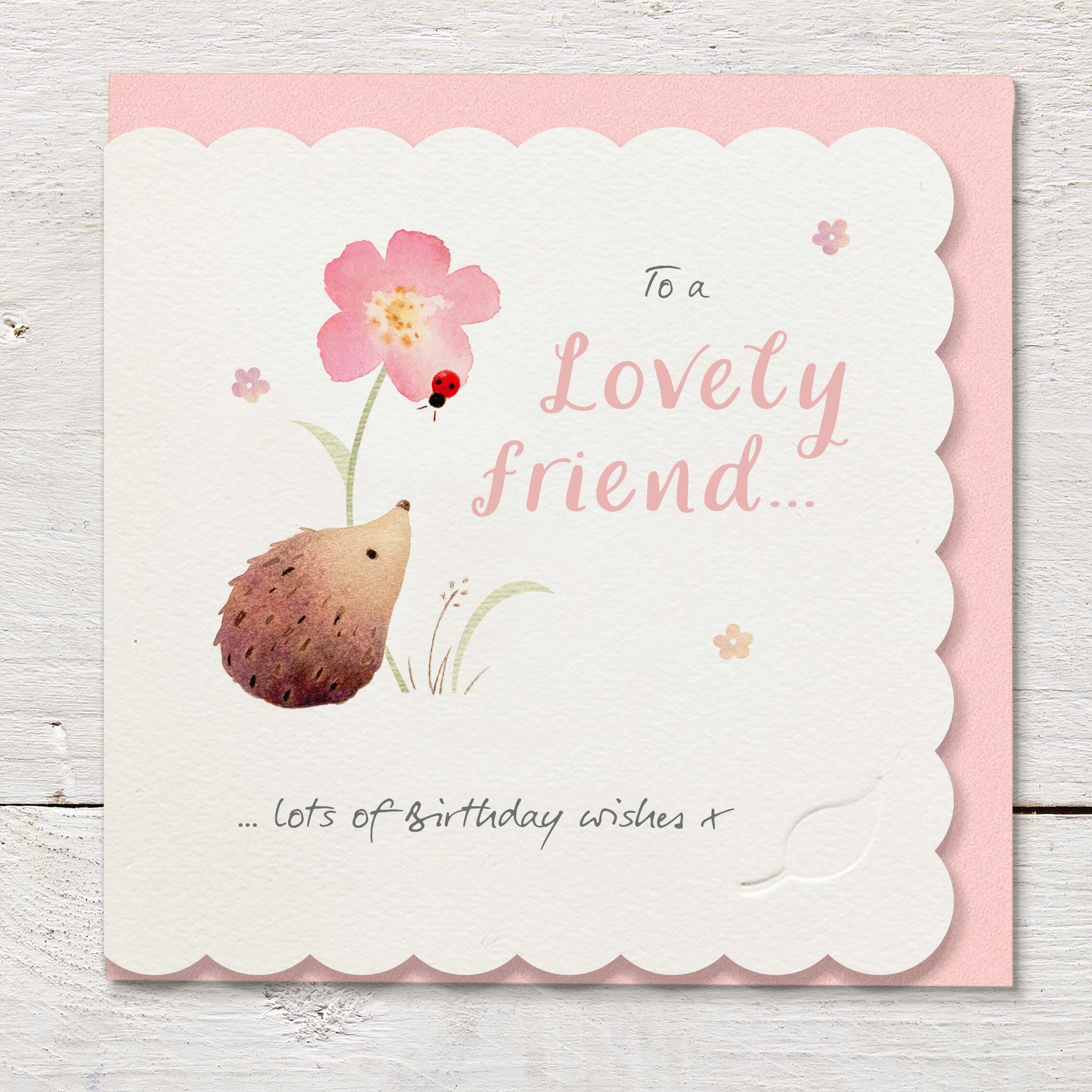 Die cut cardfeaturing a hedgehog and large pink flower.
