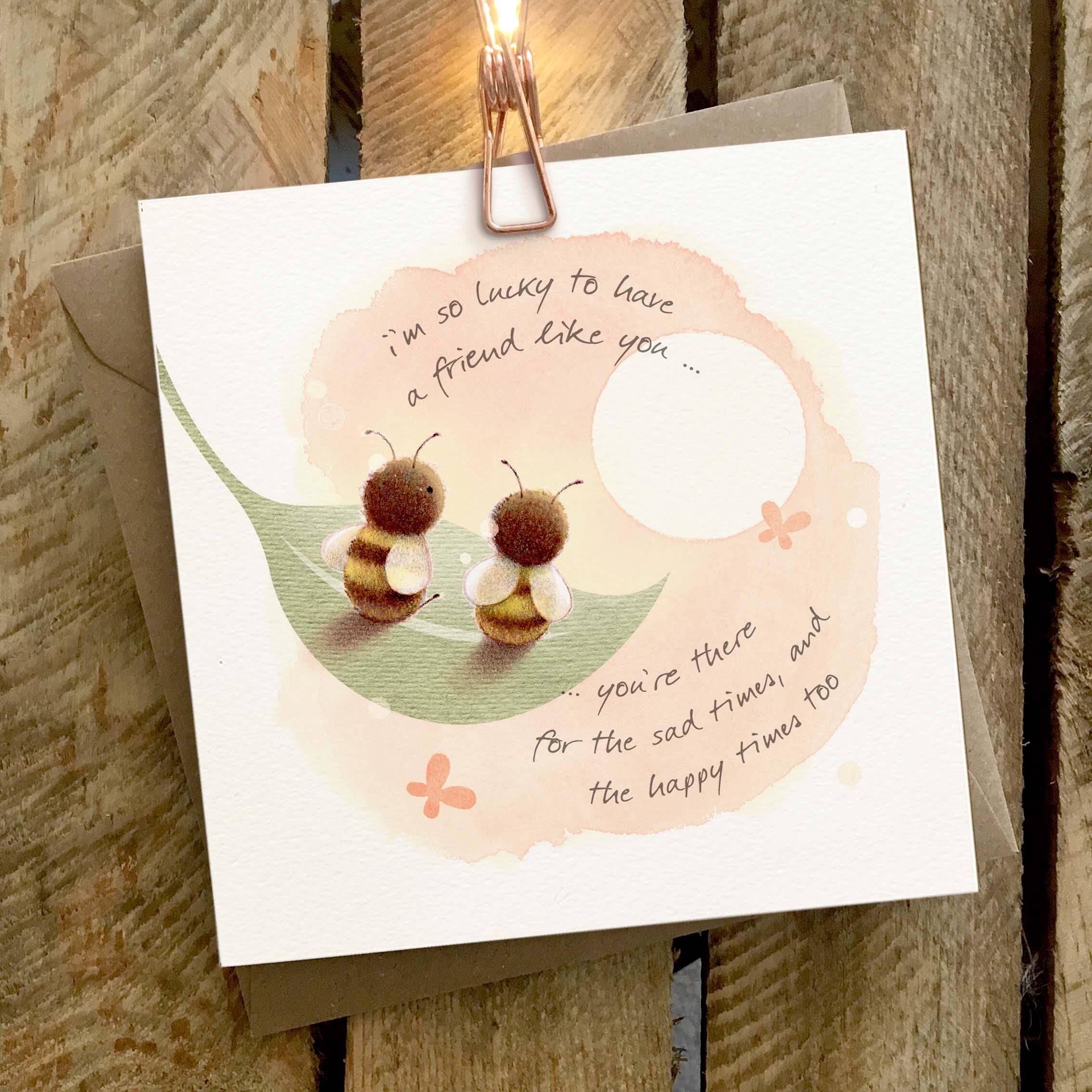 Greetings card featuring two bees on a leaf in the sunshine.