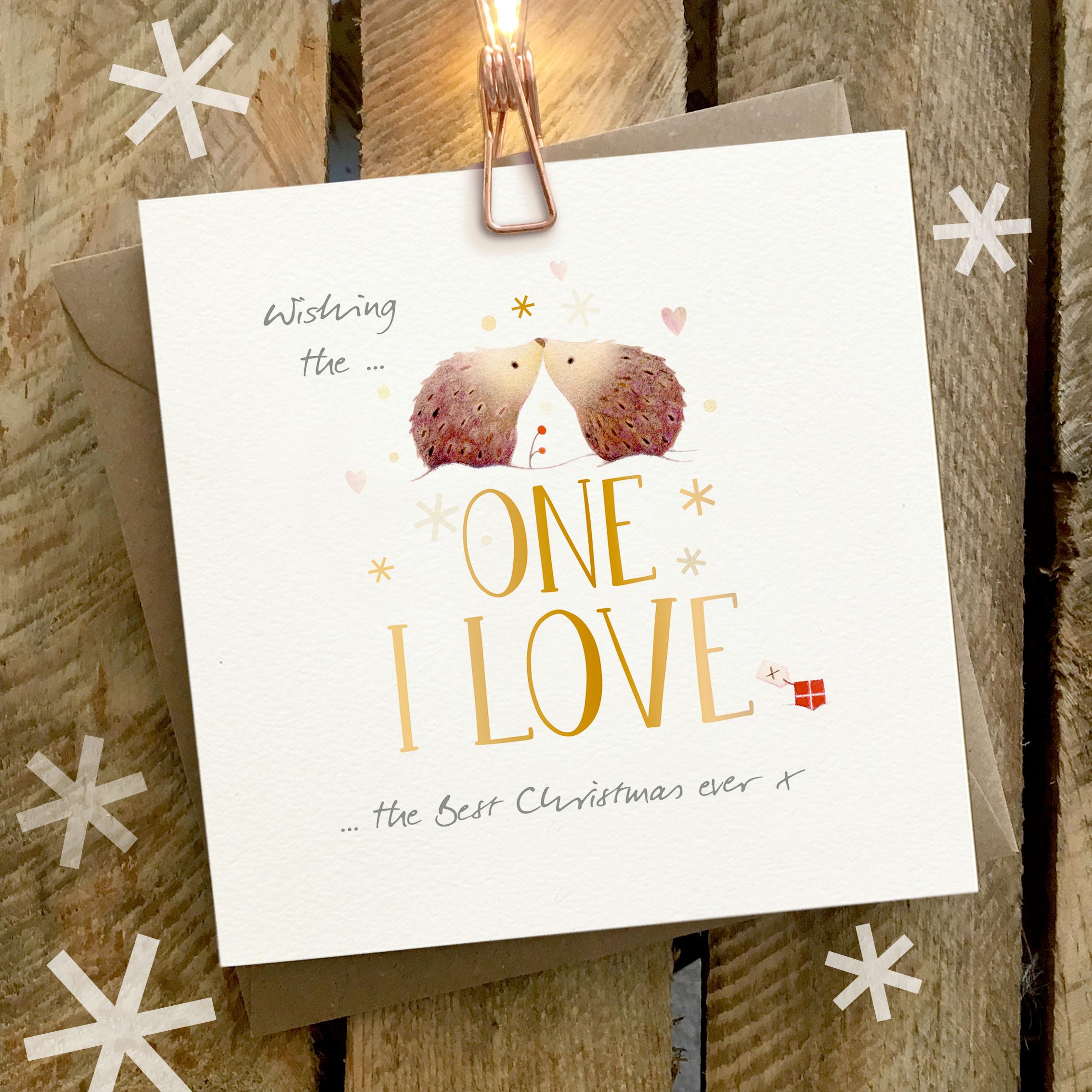 Christmas Card featuring a large gold foil One I Love caption with a beautifully illustrated hedgehog couple rubbing noses
