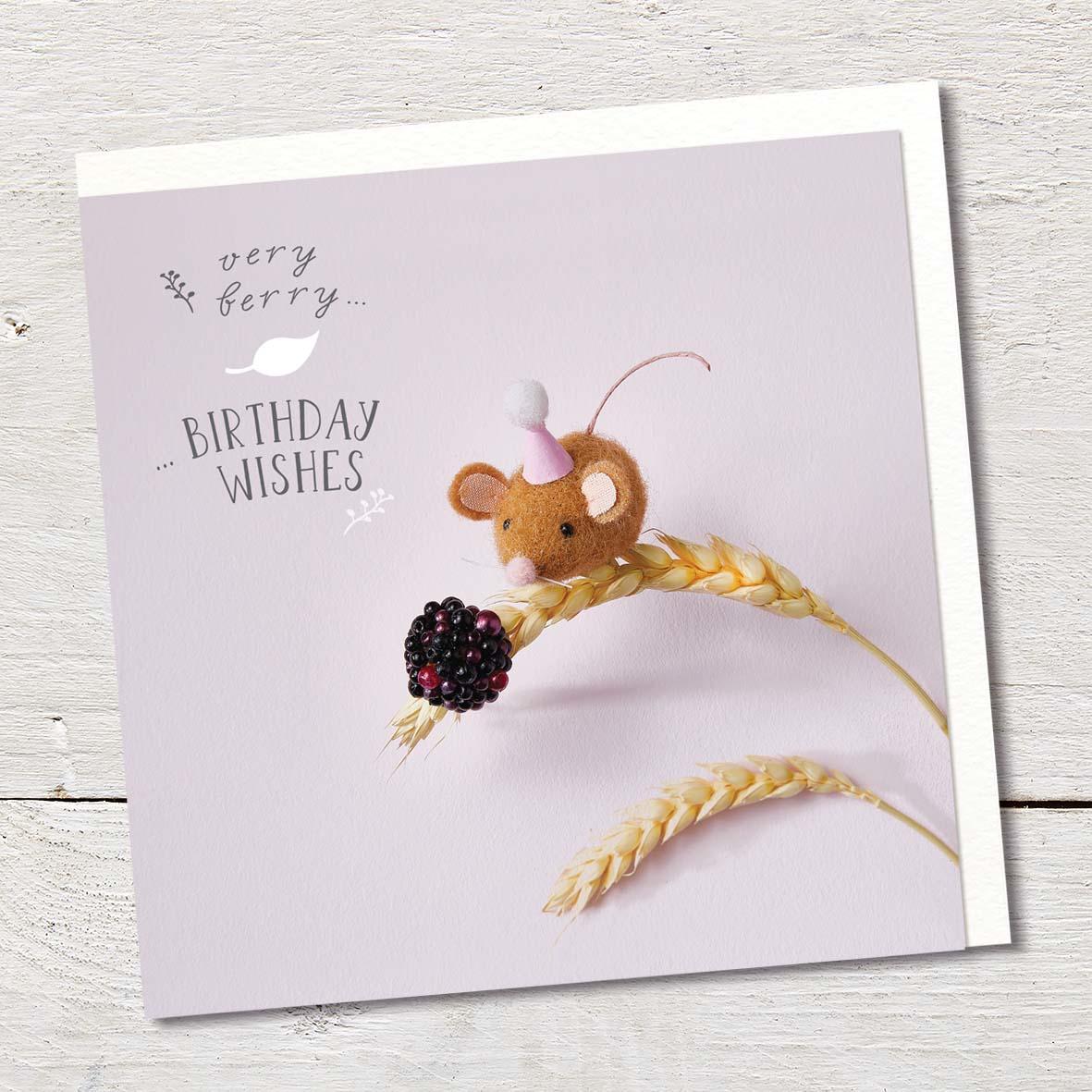 Card featuring a cute felted mouse, wearing a tiny hat, with a blackberry and sitting on wheat.