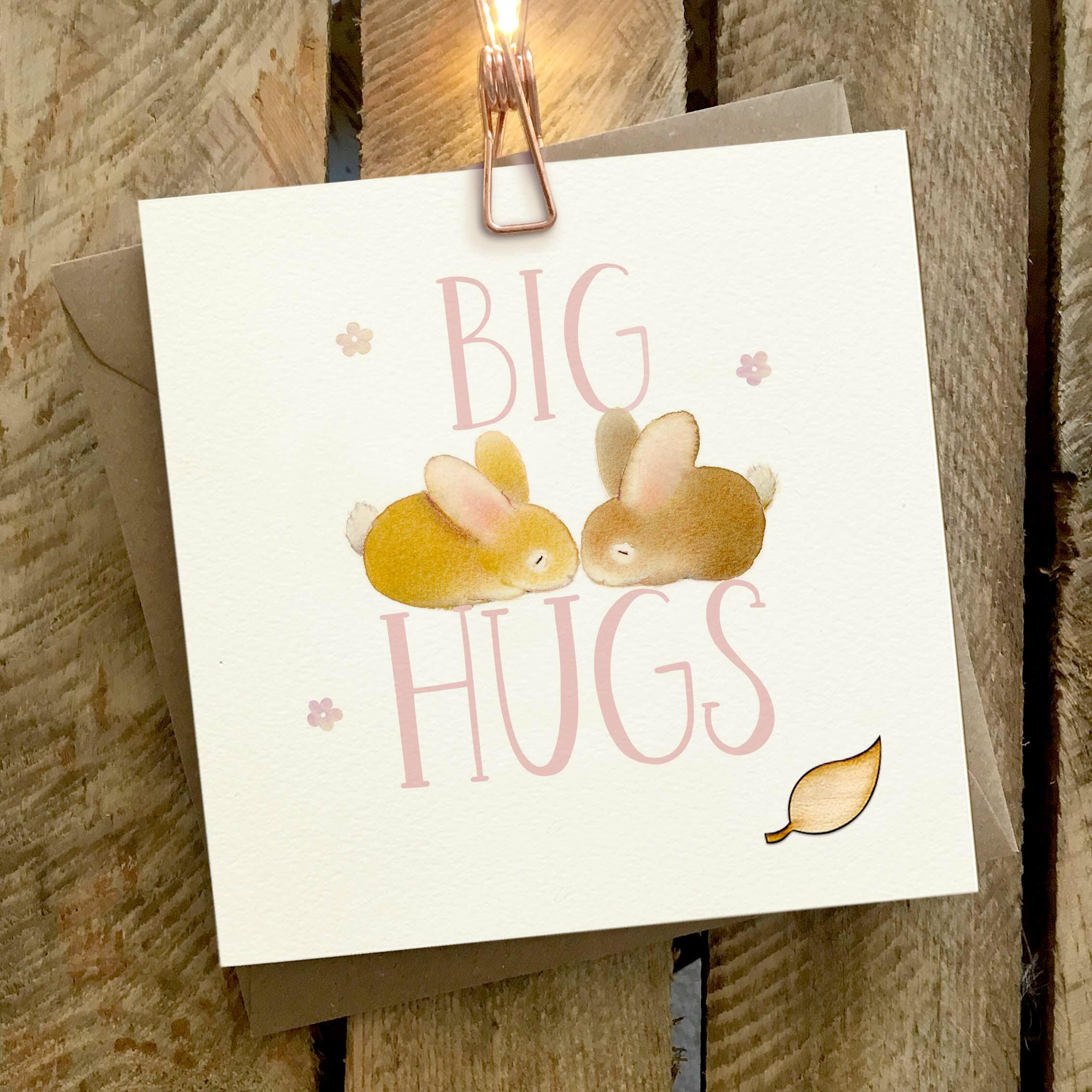 Card featuring two cute rabbits sitting on a large BIG HUGS caption.