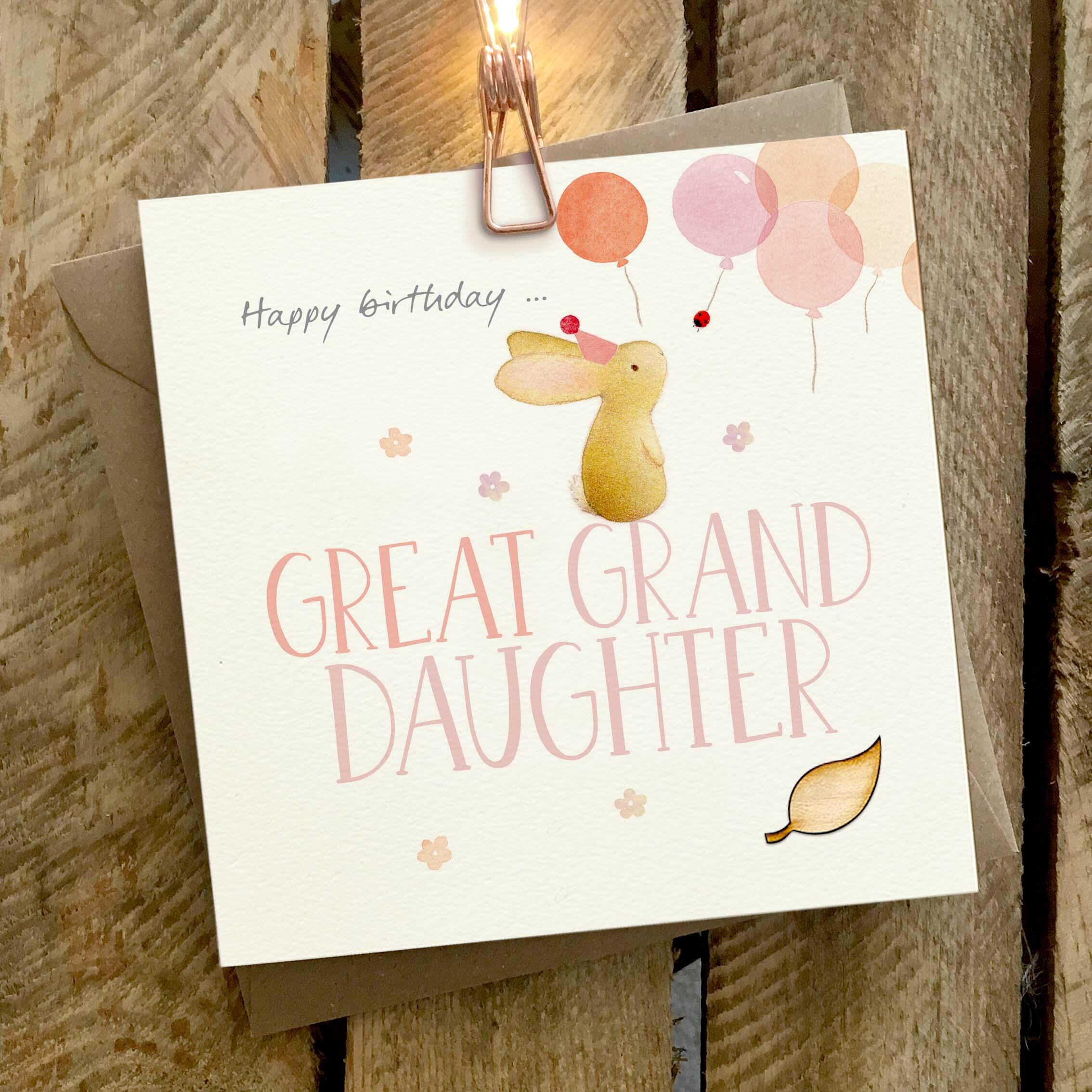 Card featuring a cute rabbit sitting on top of a large ‘Happy birthday, GREAT GRAND DAUGHTER’ caption.