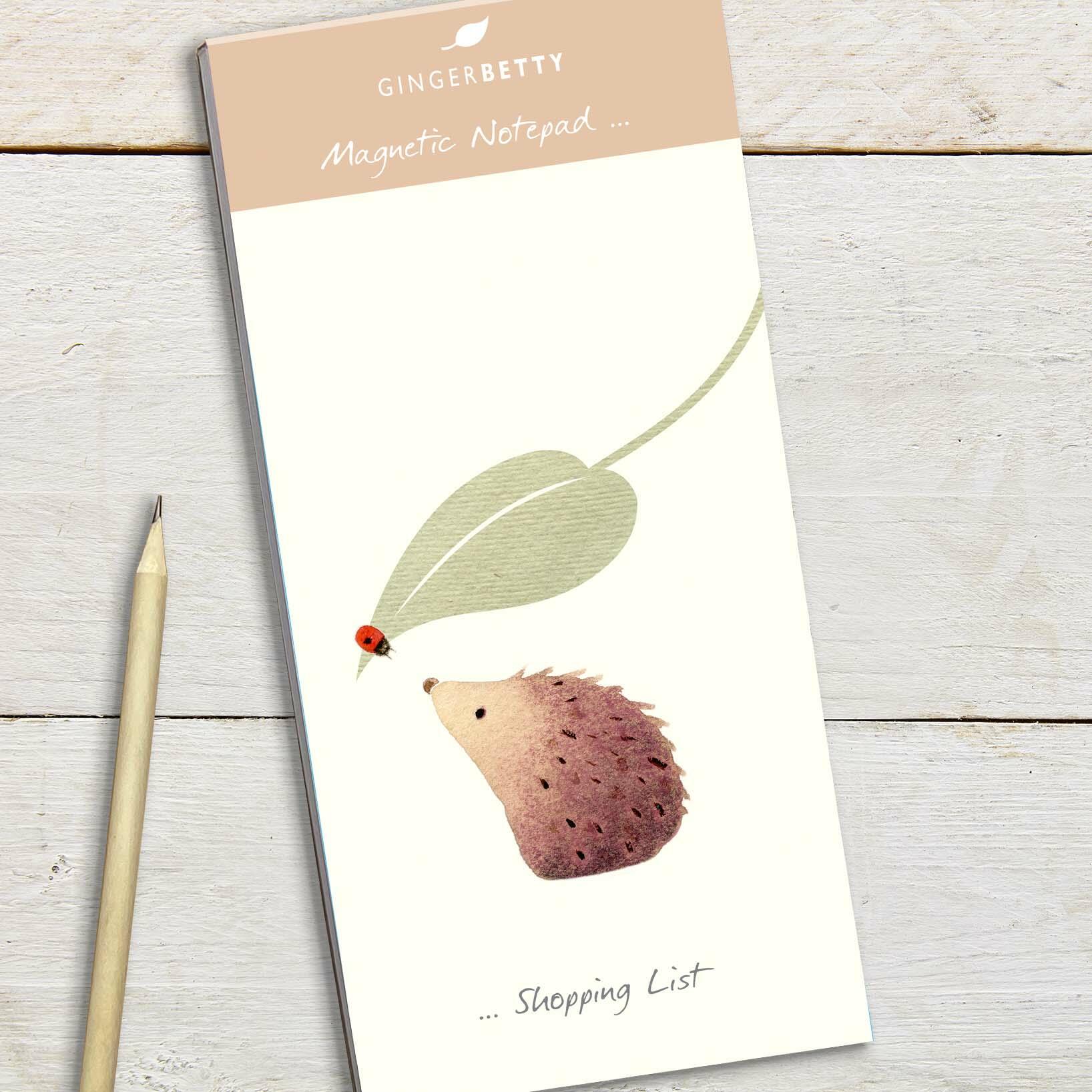 Magnetic Notepad cover with illustration of a cute hedgehog looking at a ladybird.