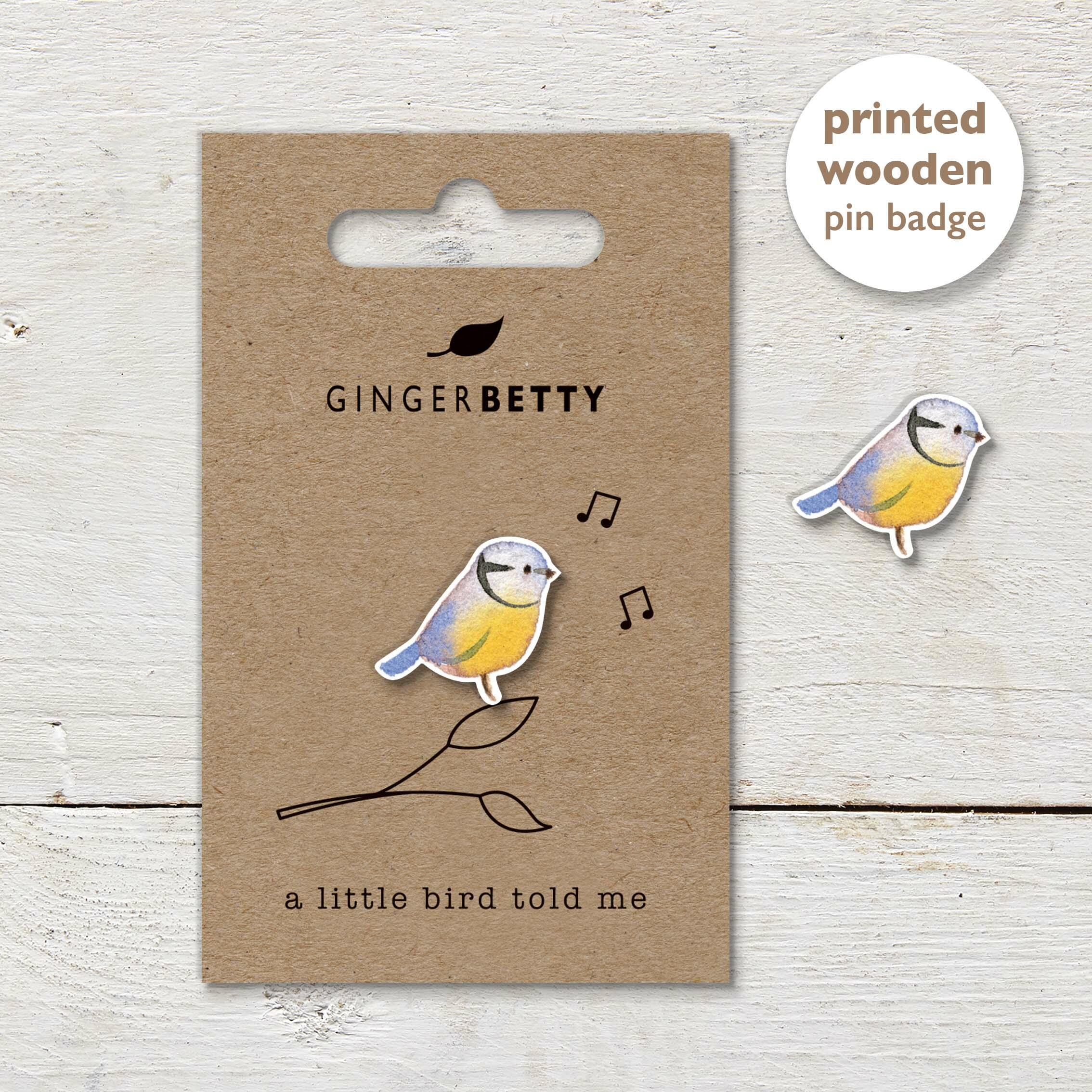 Bluetit pin badge with a line illustration and ‘A little bird told me’ caption.