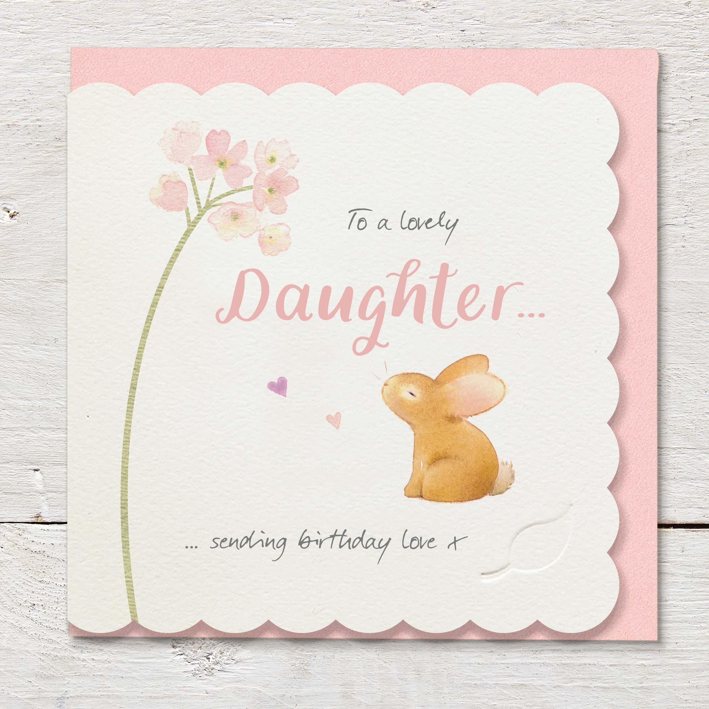 Die cut cardfeaturing a stem of small pink flowers and cute rabbit.
