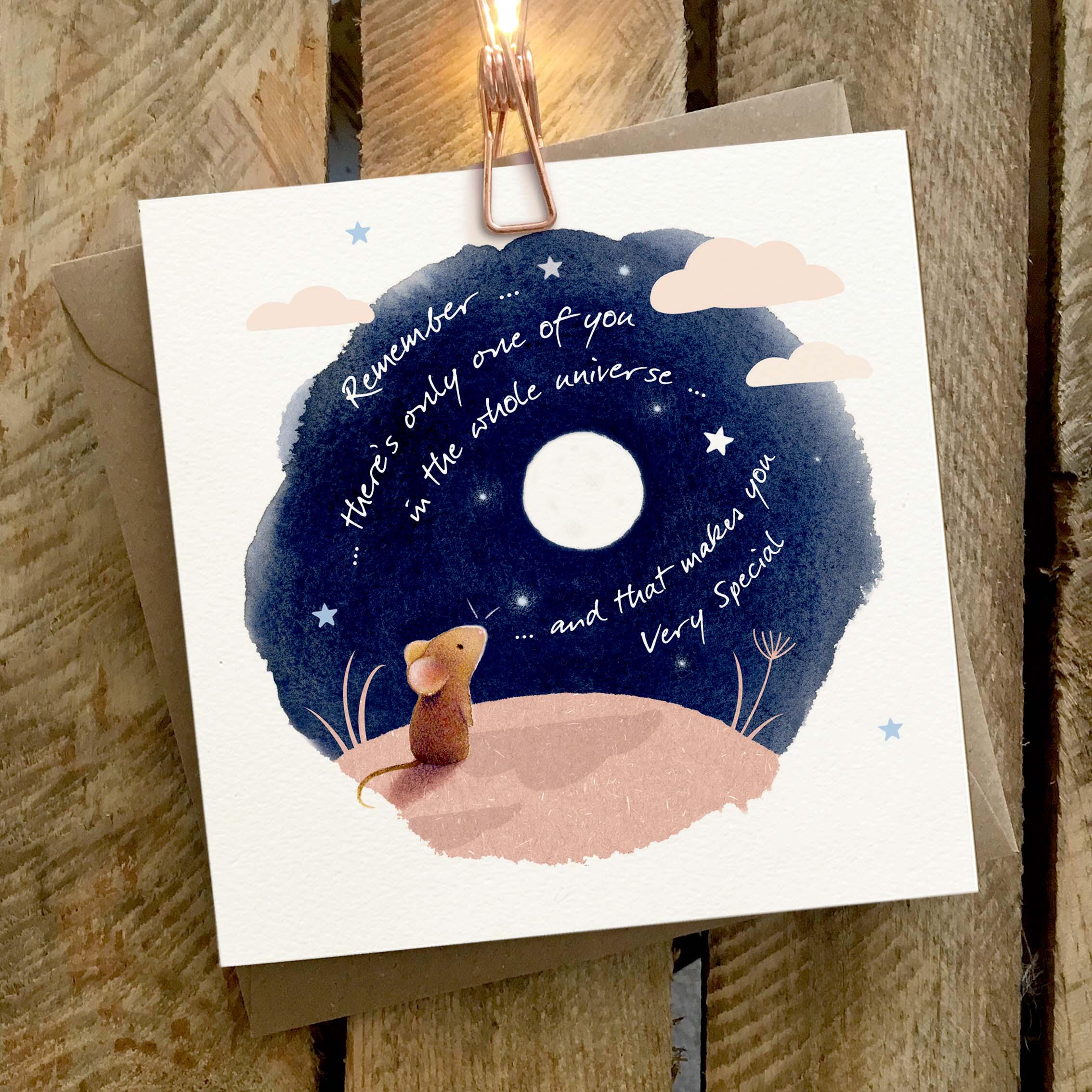 Greetings card featuring a mouse on a moonlit hill with the moon in the night sky.