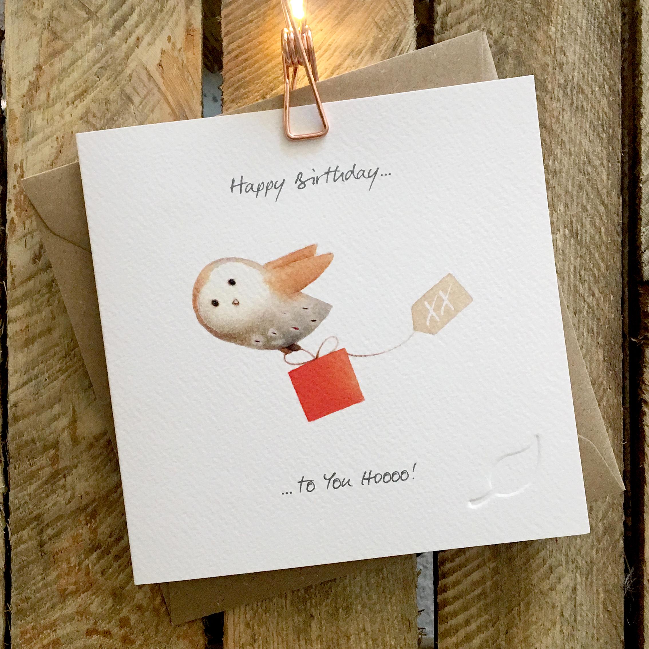 Card featuring cute flying barn owl carrying present