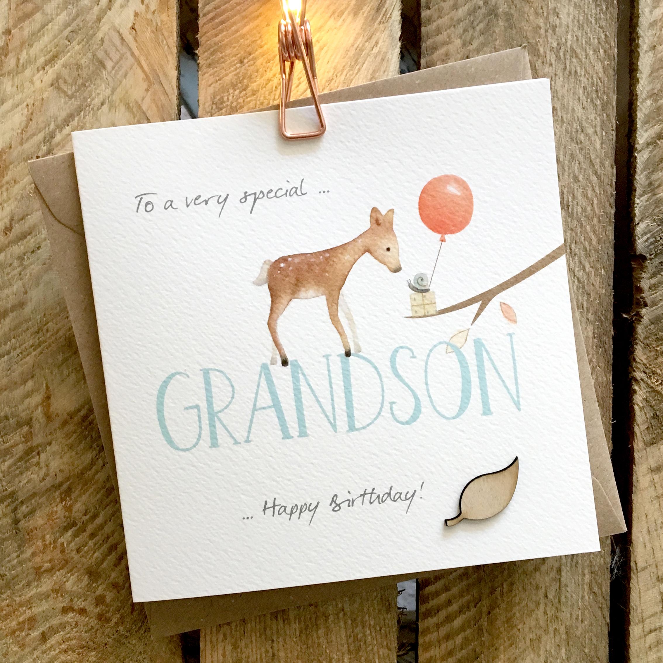 Card featuring a cute 'Bambi' fawn standing on top of a large GRANDSON caption