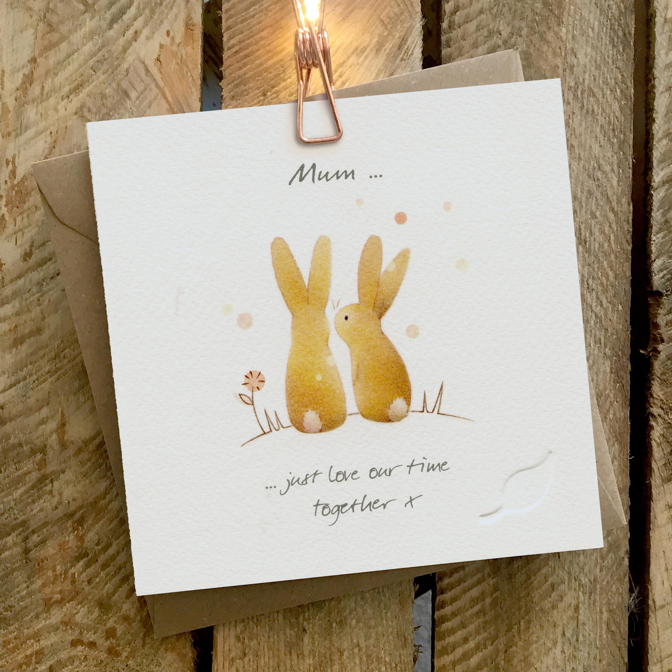 Card featuring two cute rabbits sitting in the sunshine