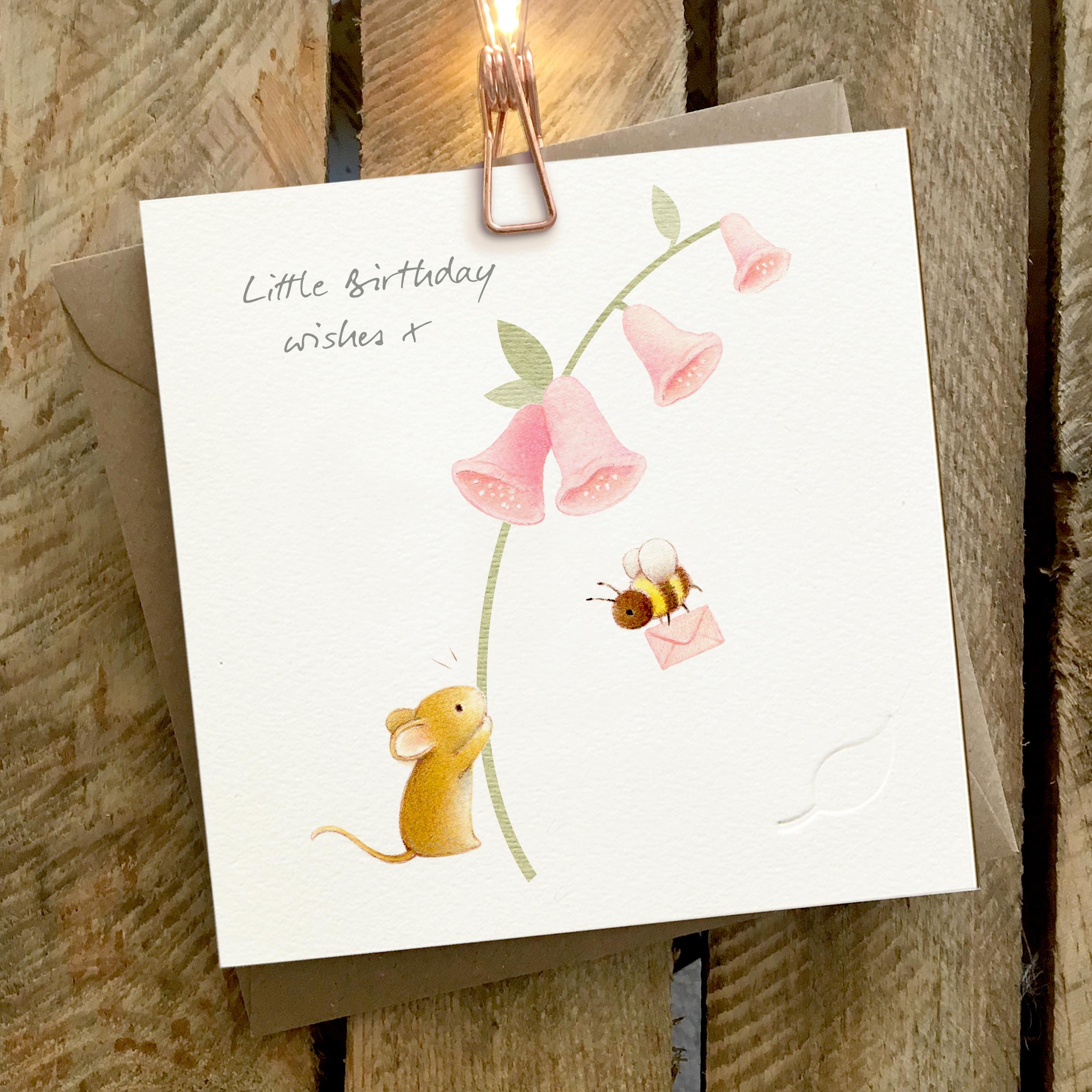 Card featuring a tiny cute mouse holding a foxglove and a bumble bee carrying an envelope. Caption reads “Little Birthday Wishes X”