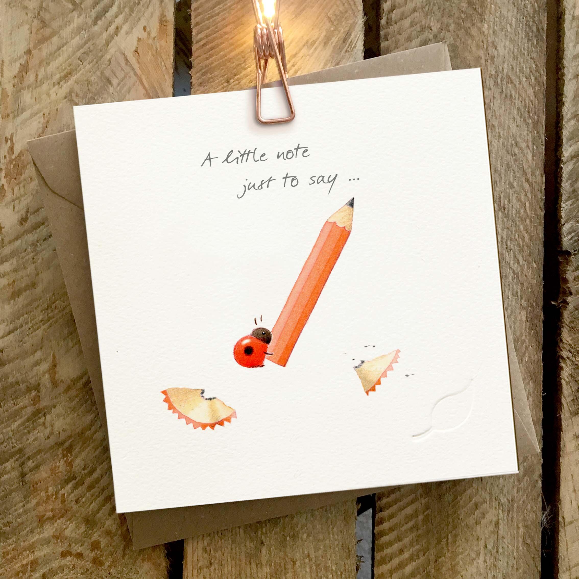 Card featuring a cute little ladybird with a large red pencil. Caption reads ‘A little note just to say’.