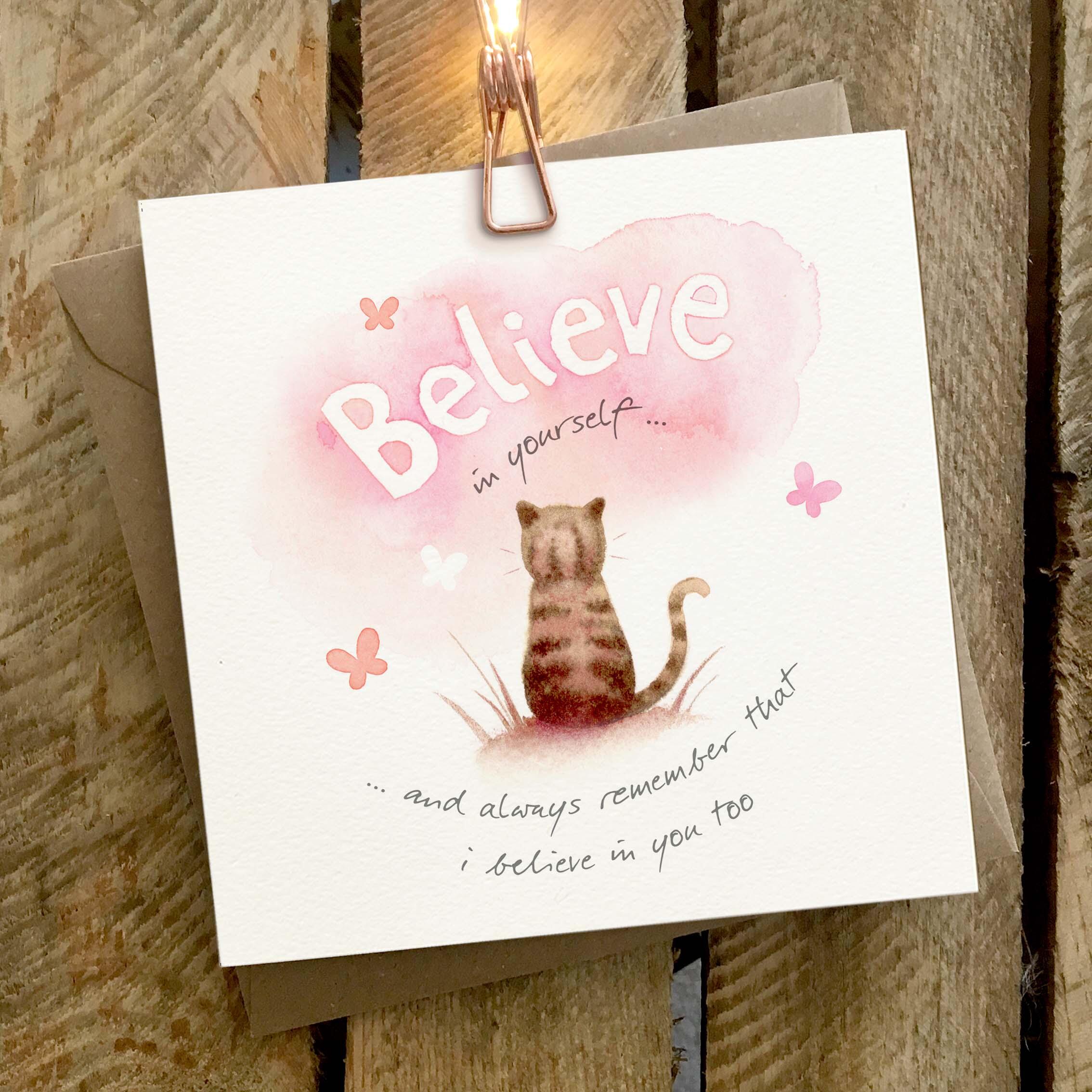 Greetings card featuring a cat on a sunny hillside.