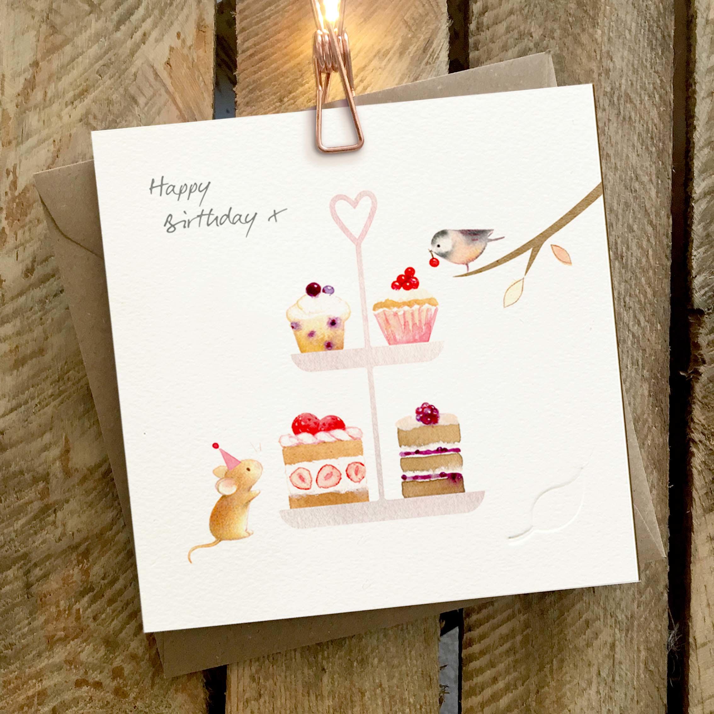 Card featuring a cute mouse and bird with a cake stand full of cakes and muffins