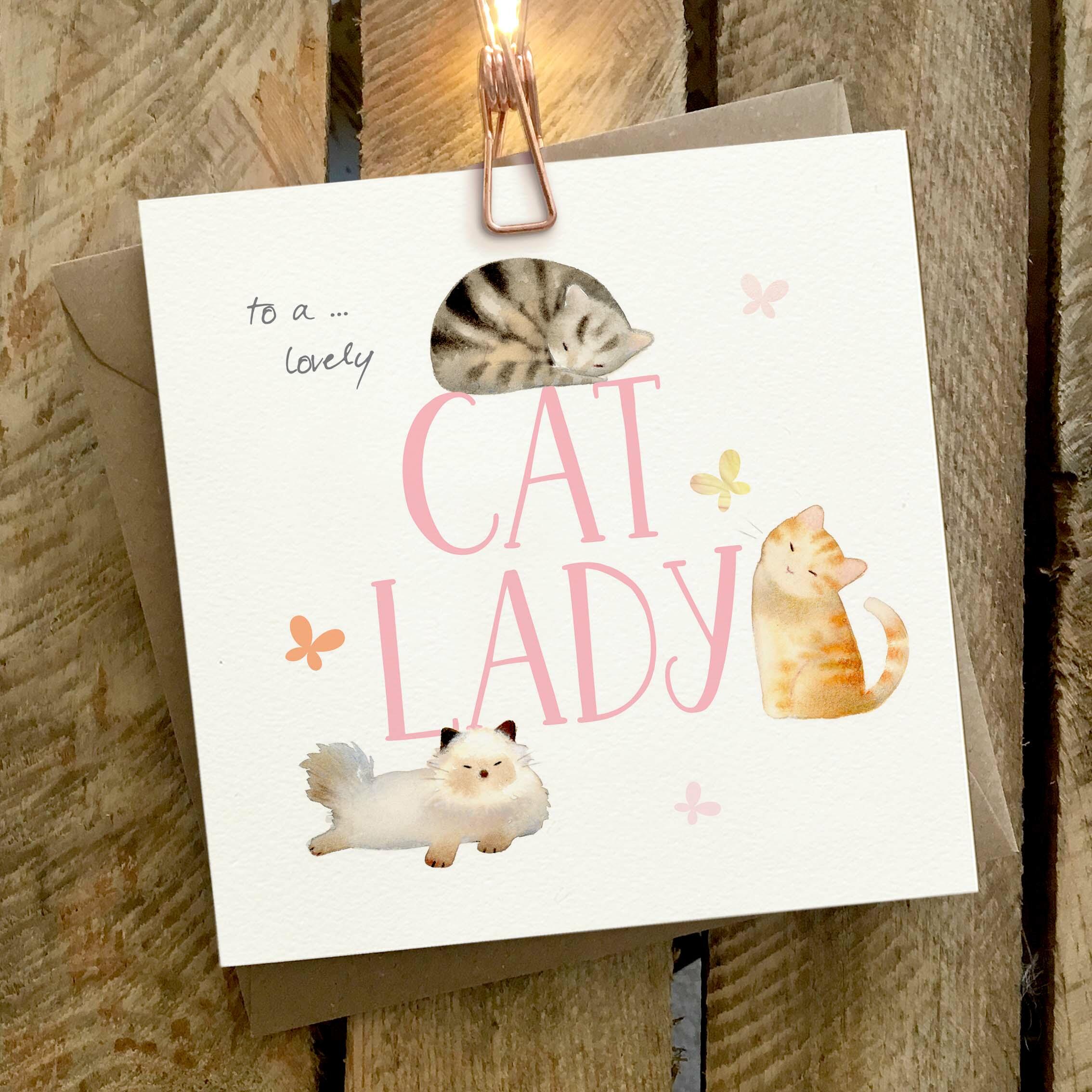 Card featuring three cats around a large to a lovely CAT LADY caption.