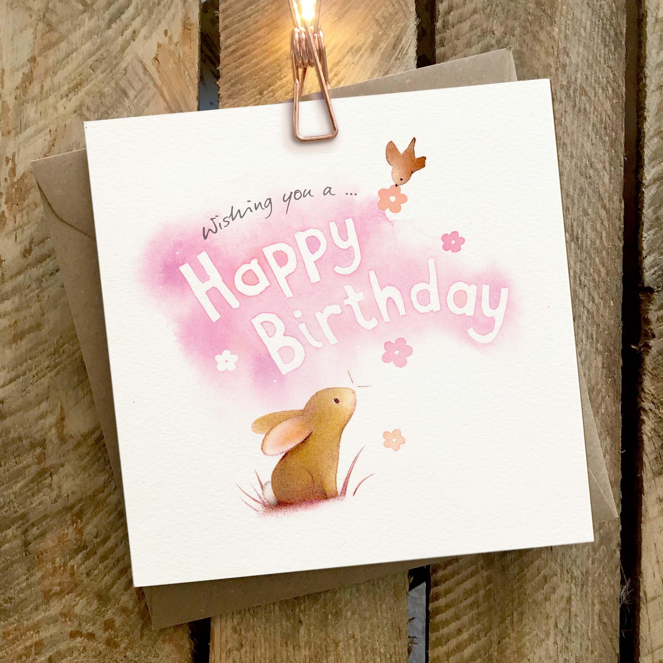 Greetings card featuring rabbit and bird.