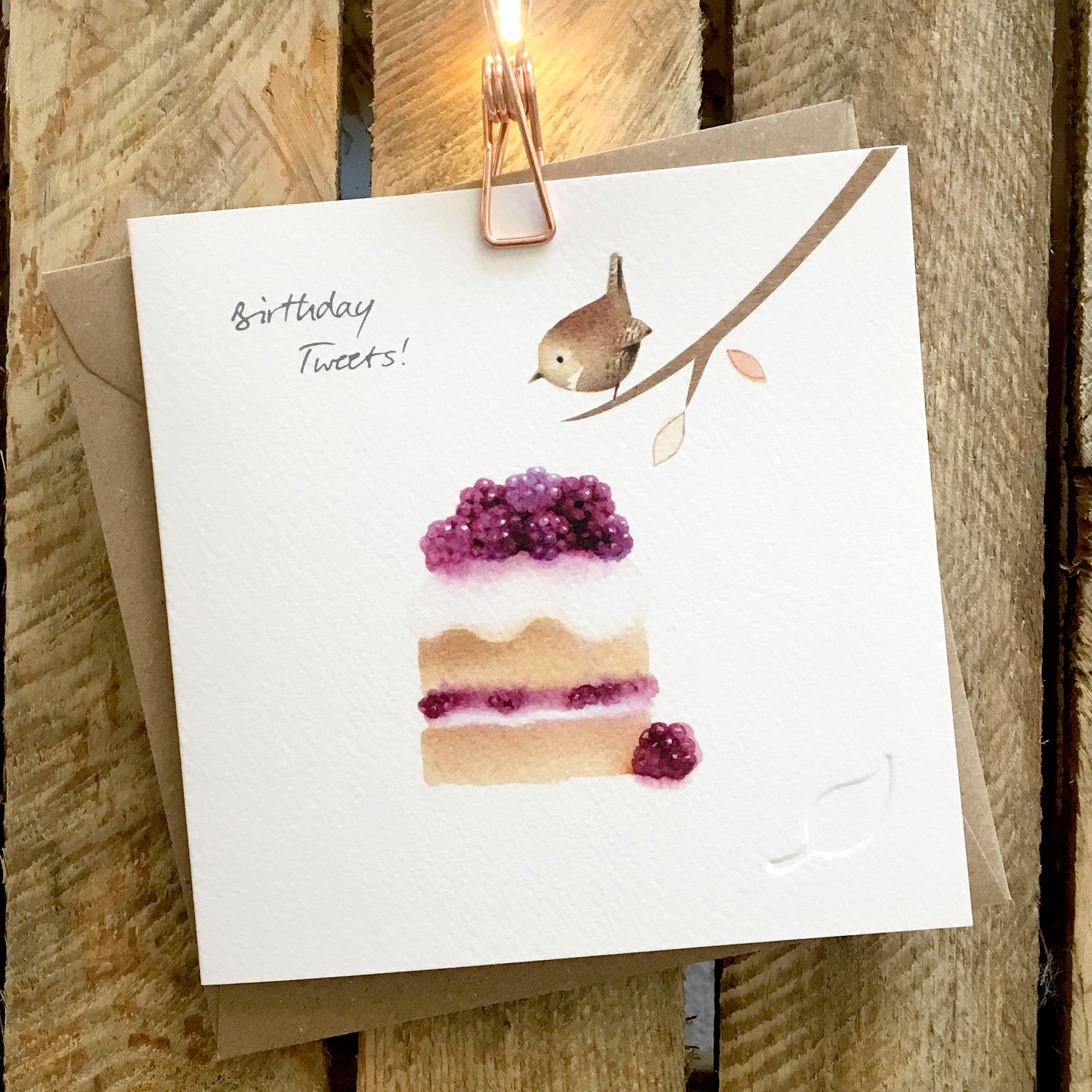 Card featuring a tiny cute wren perched on branch, looking at a slice of delicious blackberry cake