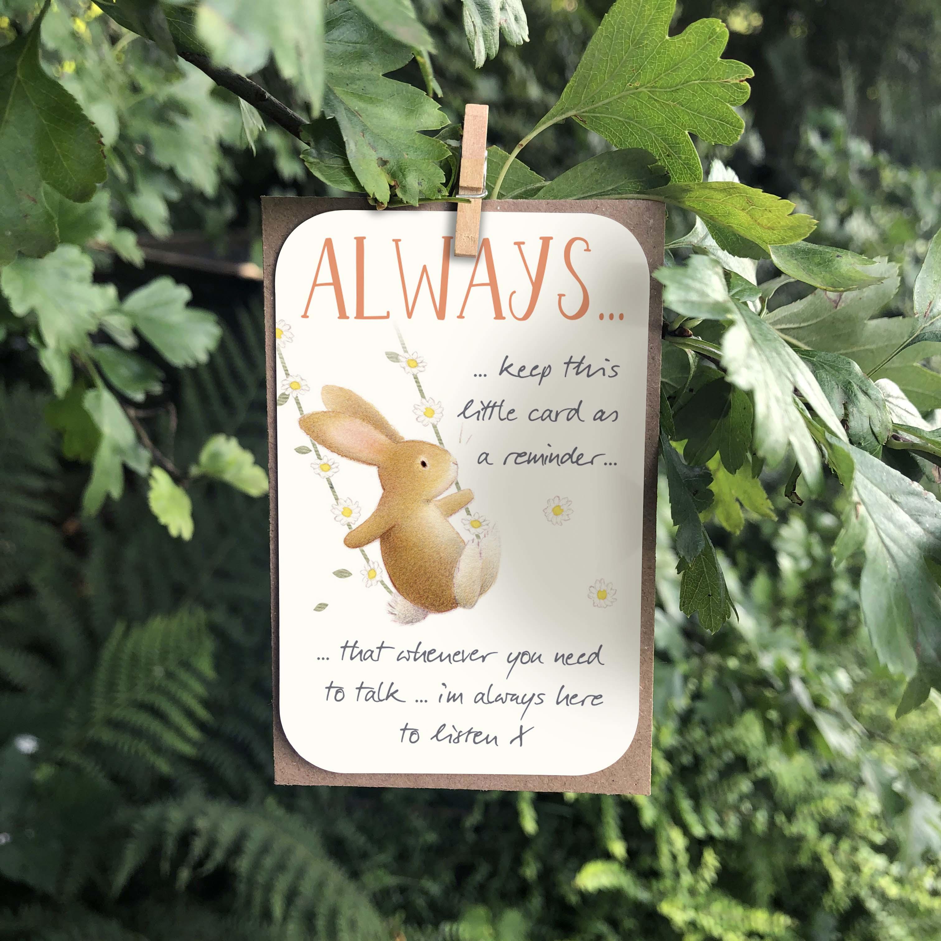 A small keepsake card with an “Always here to listen” caption and a positive little message. Features a cute rabbit on a daisy swing illustration.