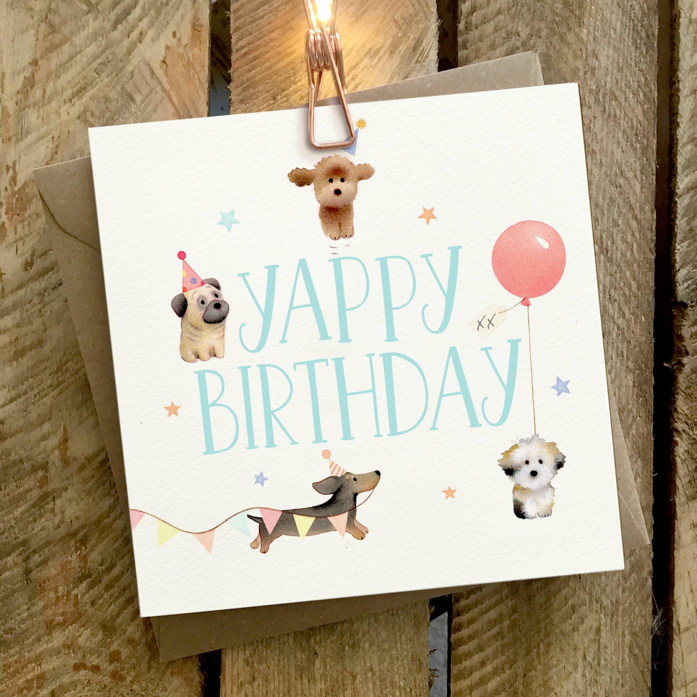 Card featuring a group of four little dogs yapping around a YAPPY BIRTHDAY caption.