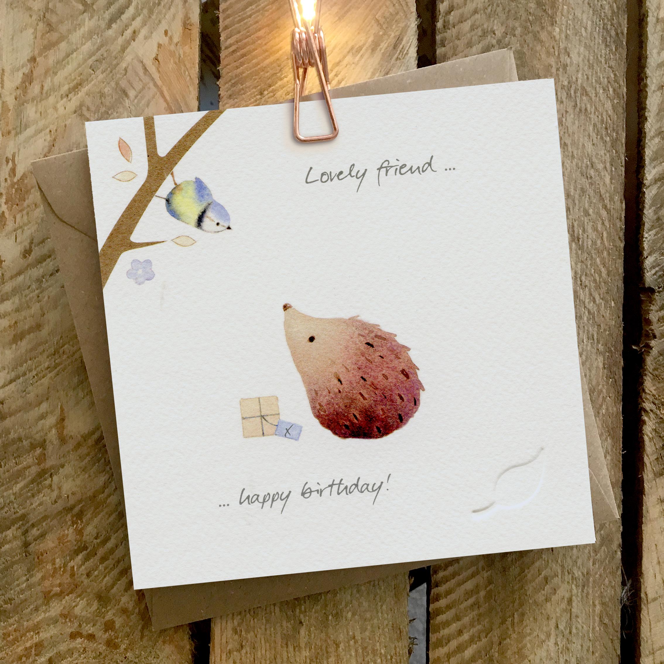 Card featuring a hedgehog looking at a bluetit in a tree