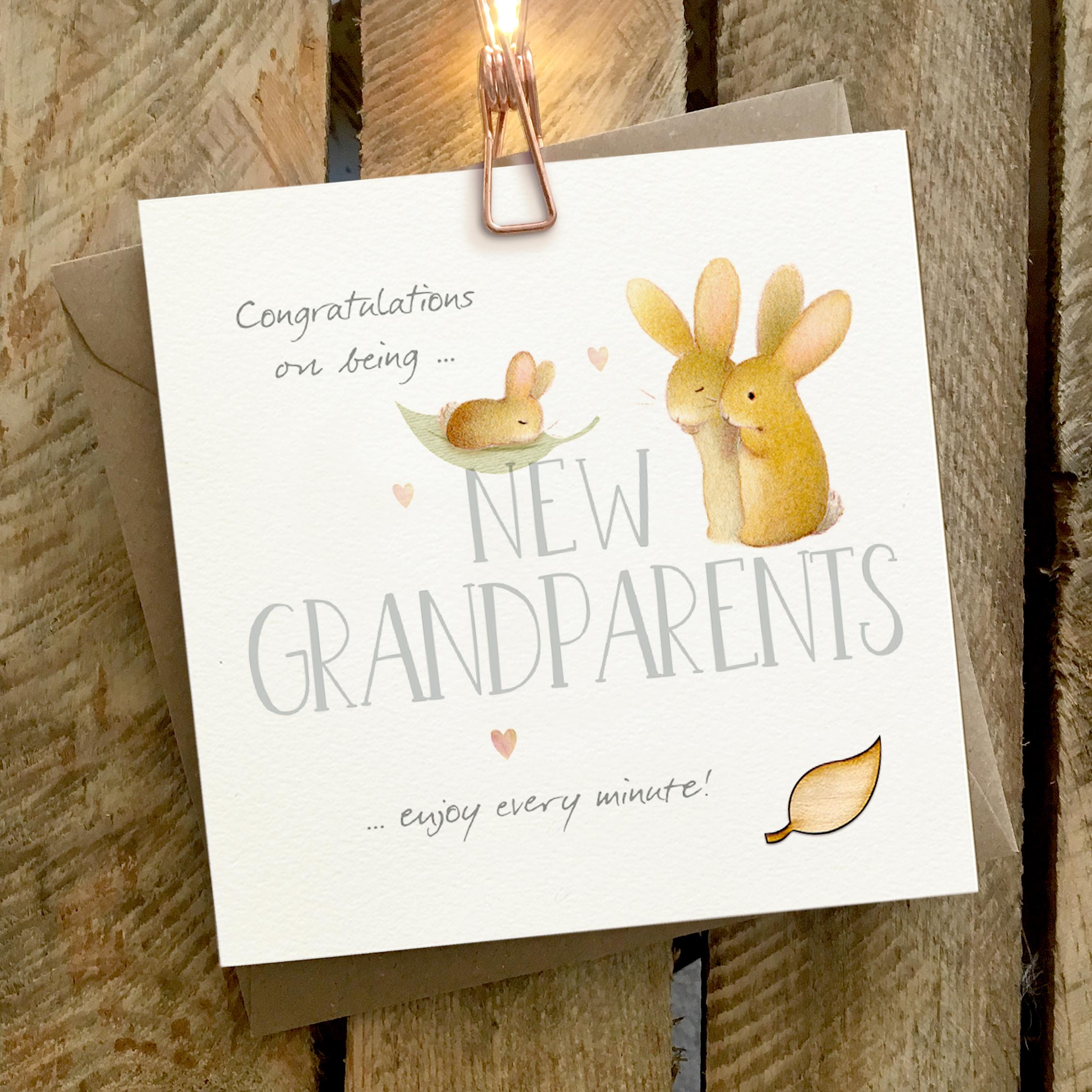 Card featuring a baby rabbit and two grandparent rabbits with a large NEW GRANDPARENTS caption