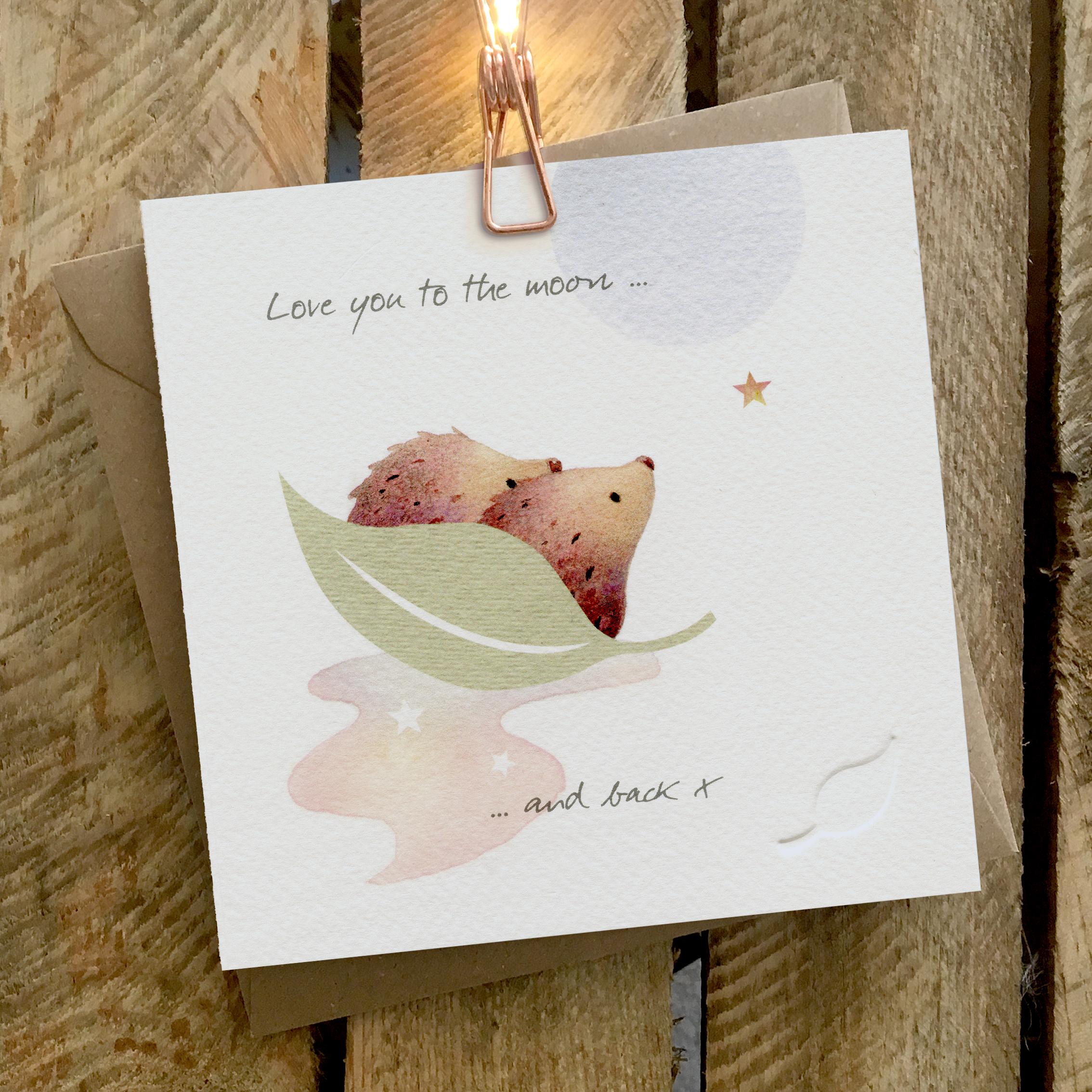 Card featuring hedgehog couple floating on a leaf looking at the moon
