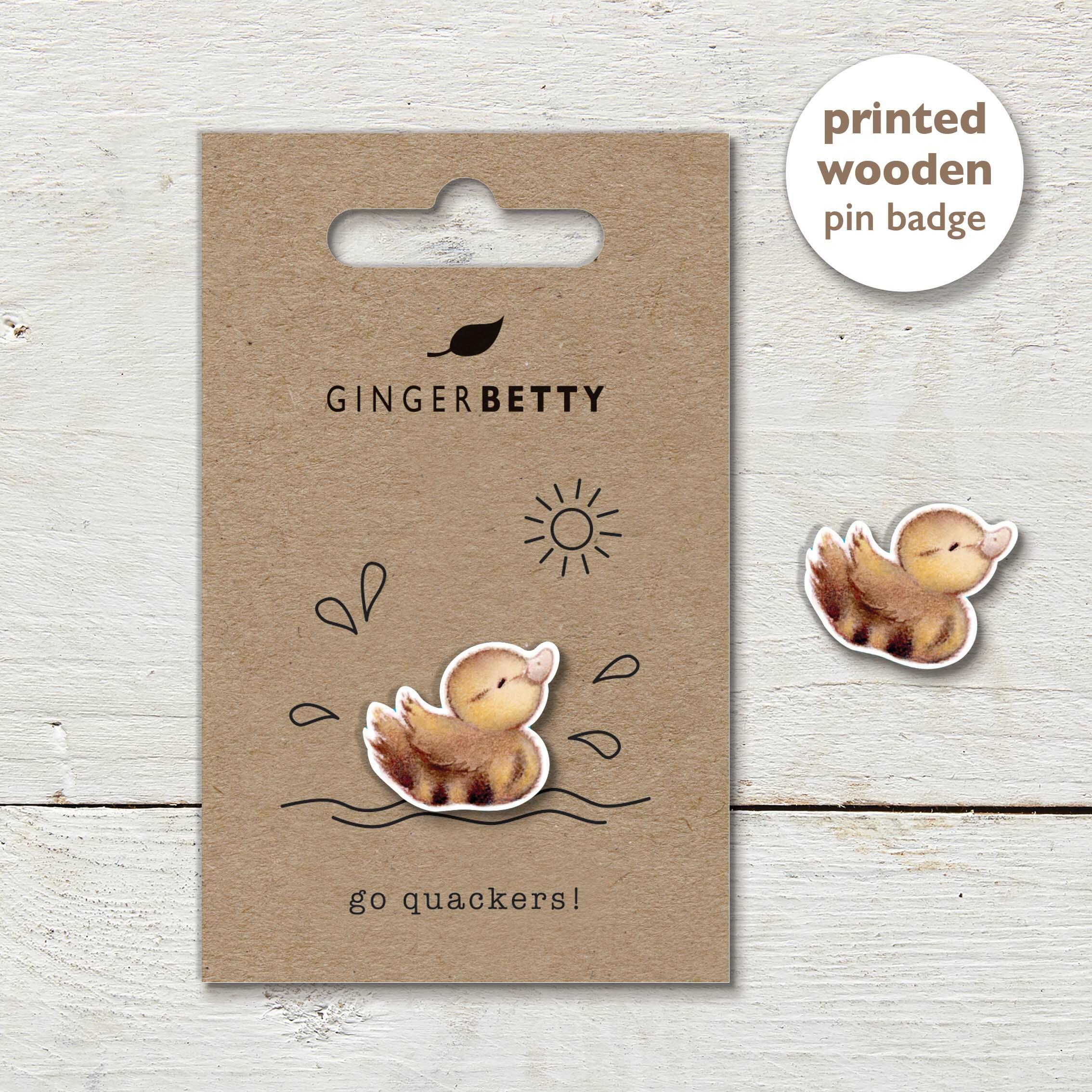 Duckling pin badge with a line illustration and ‘Go quackers’  caption.