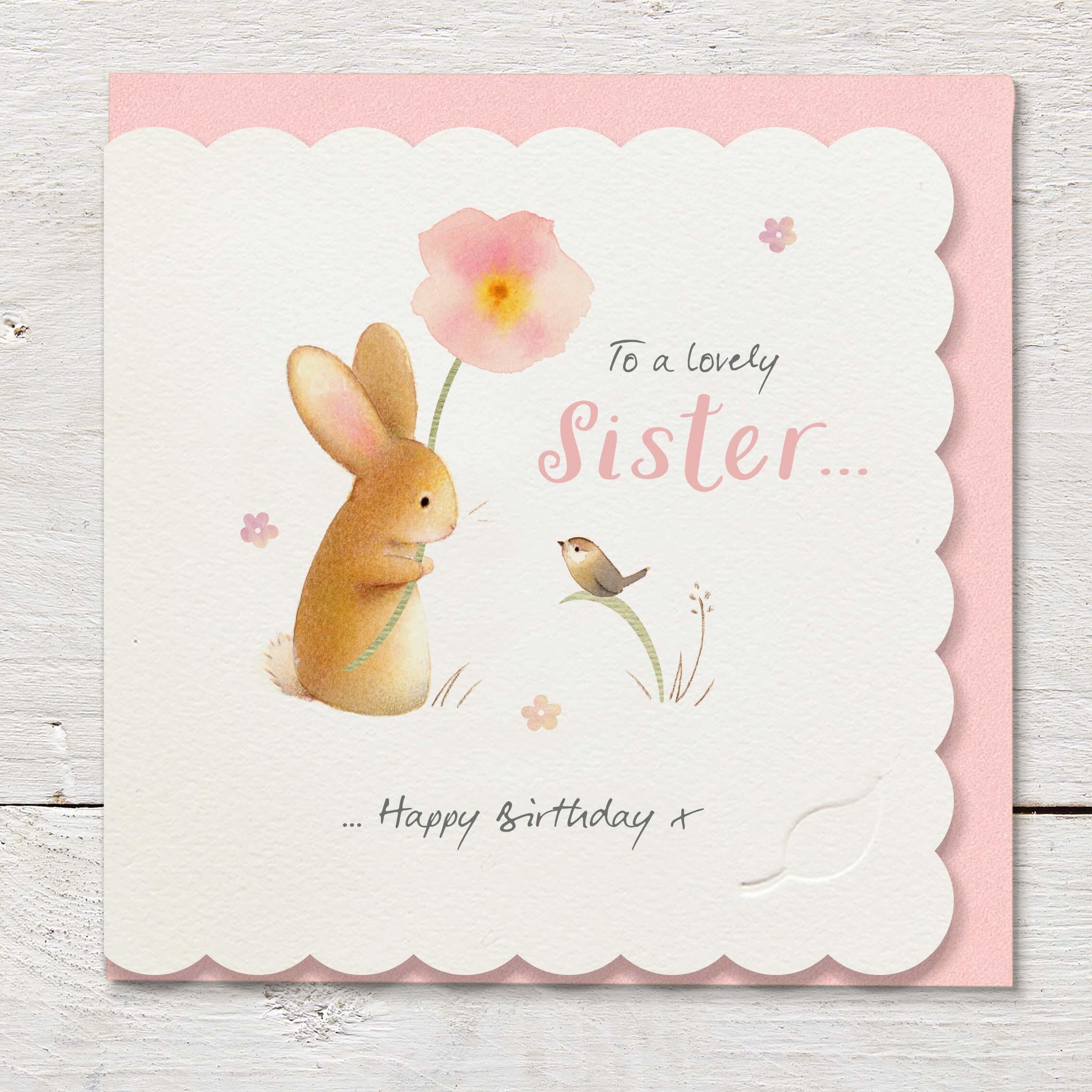 Die cut cardfeaturing a little bird with a rabbit holding a large pink flower.