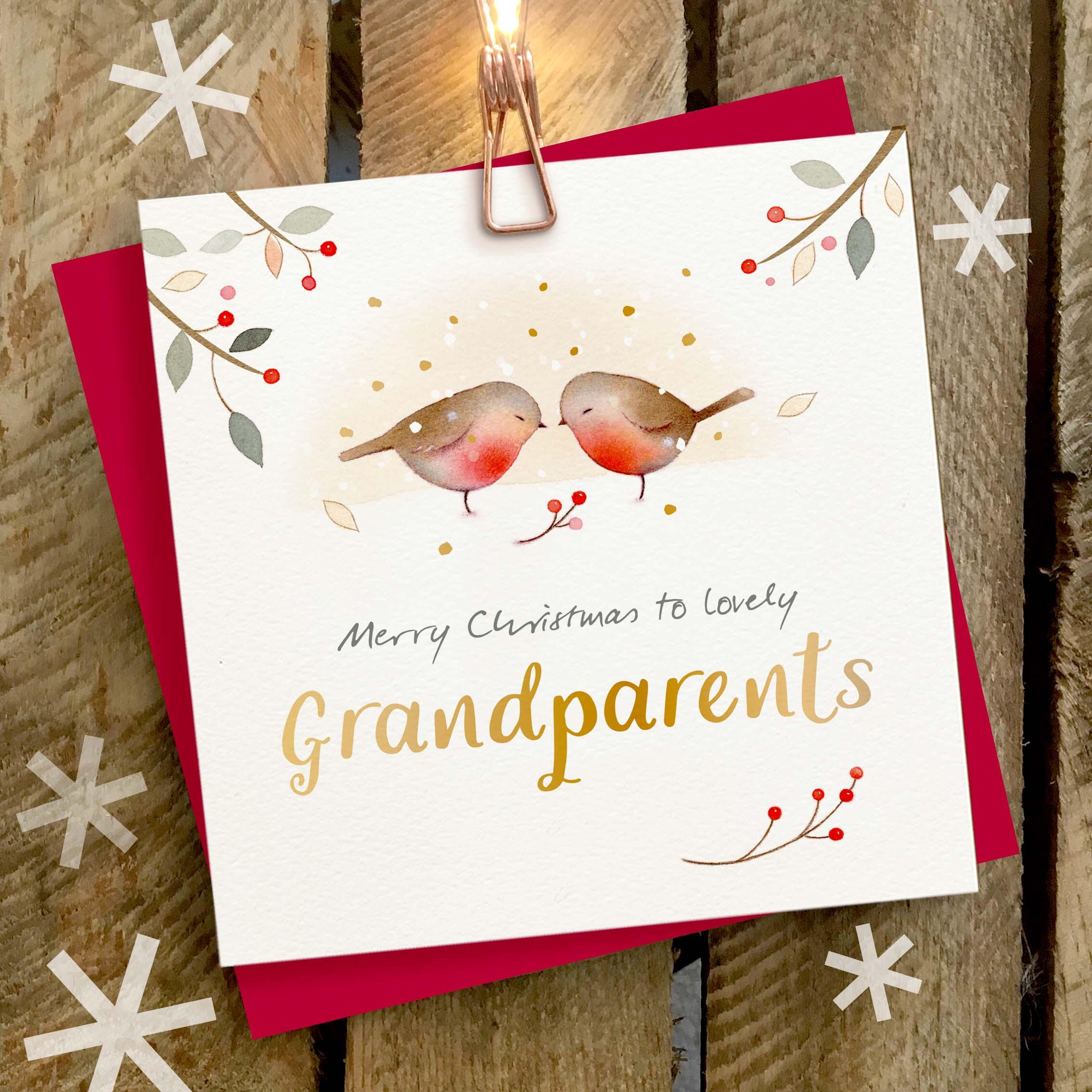 Christmas card featuring a large gold foil ‘Grandparents’ caption and two snuggling robins.