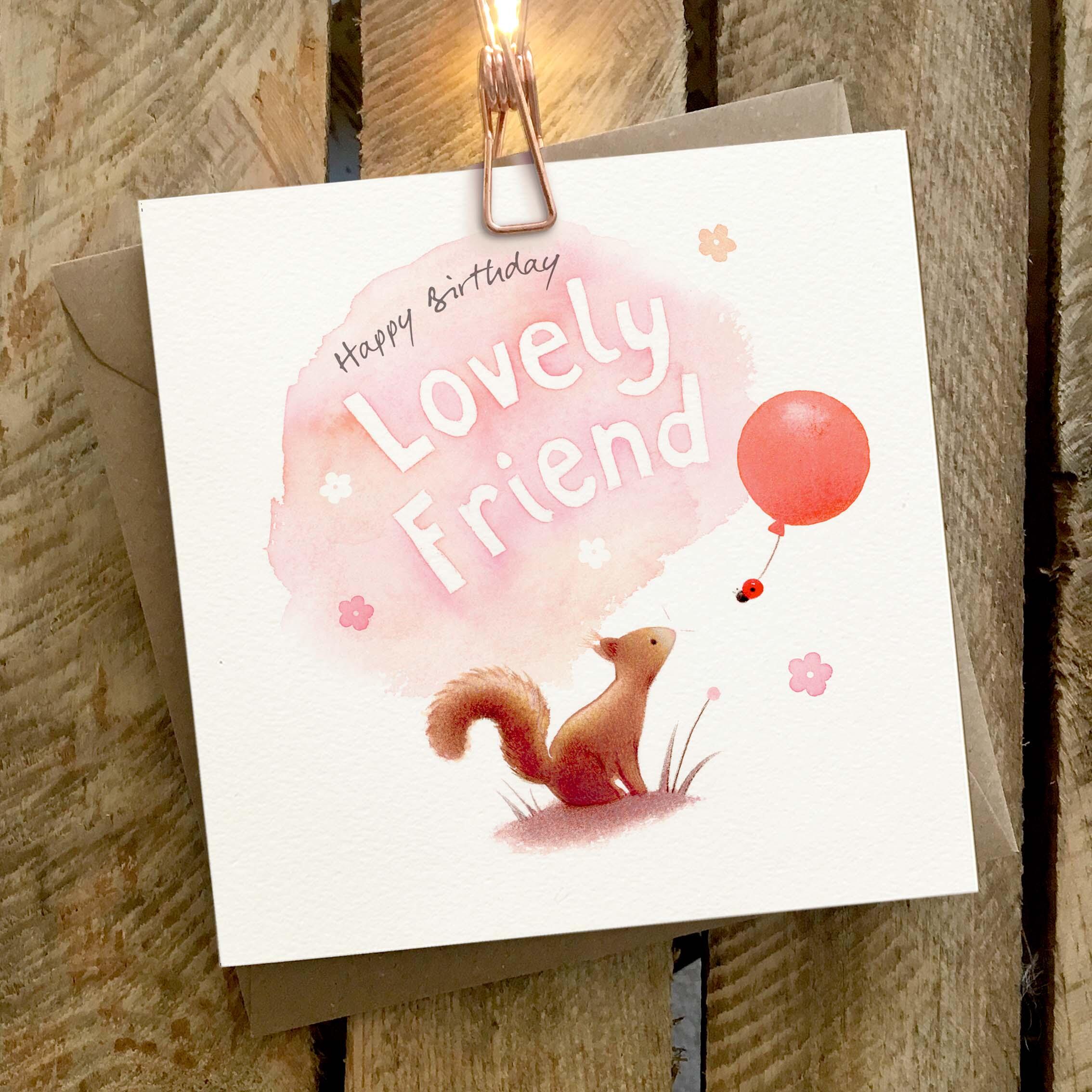 Greetings card featuring a squirrel and ladybird with balloon.