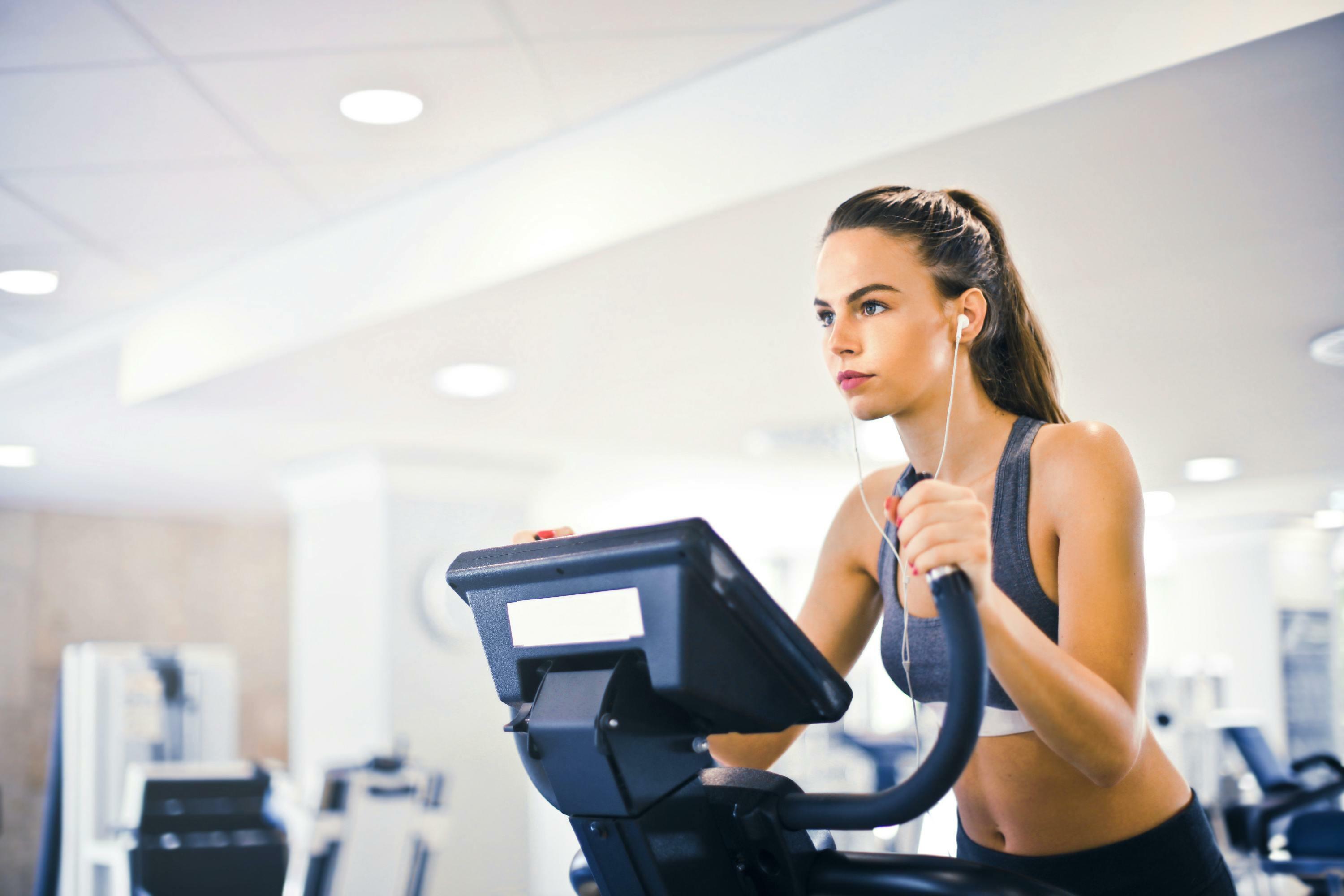 woman doing cardio workout on treadmill