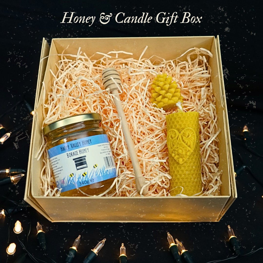 Honey and Candle Gift box surrounded by pretty white christmas lights