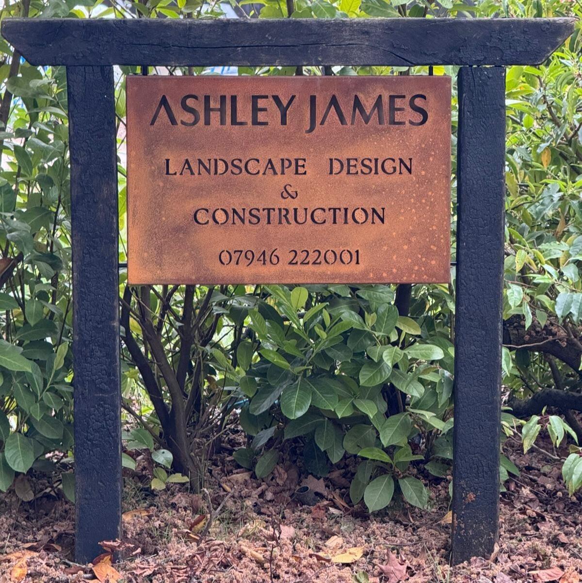 Corten steel tray hanging sign fitted between client's own posts - Custom font