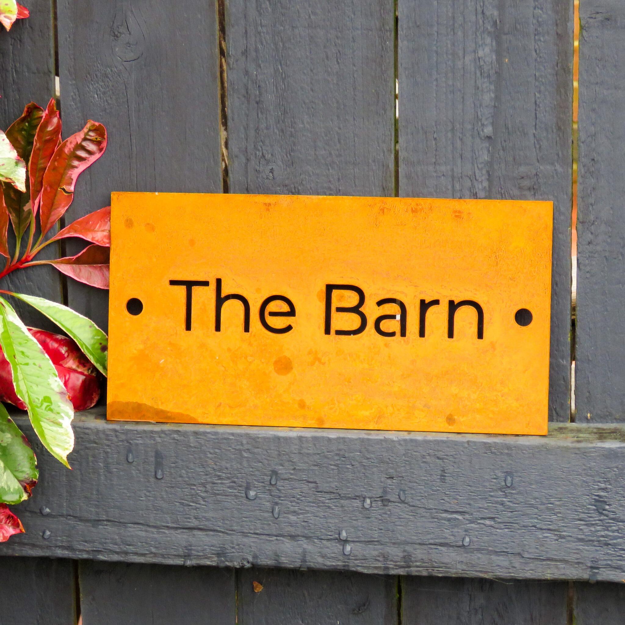 Rusty metal house sign